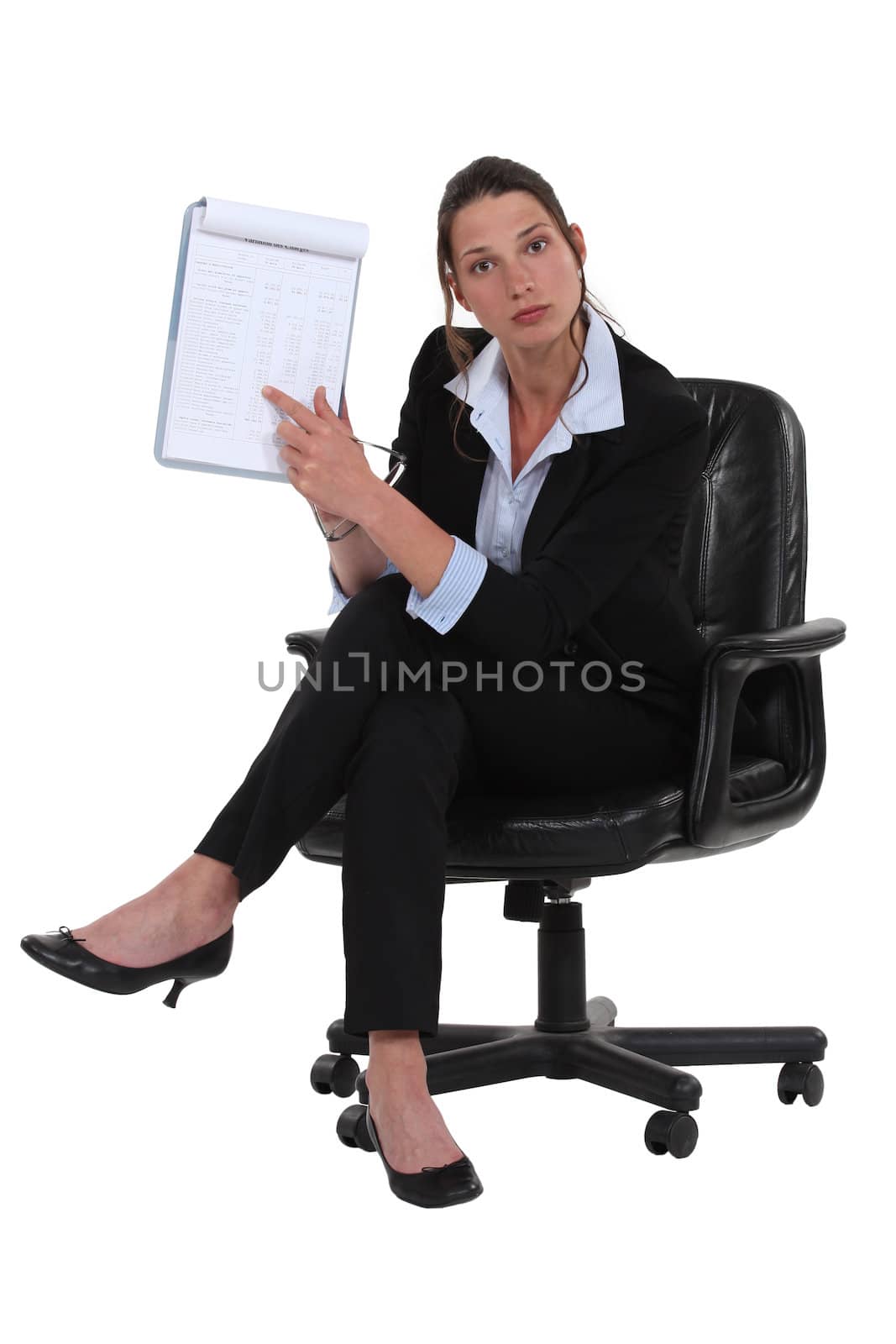 businesswoman pointing at notepad