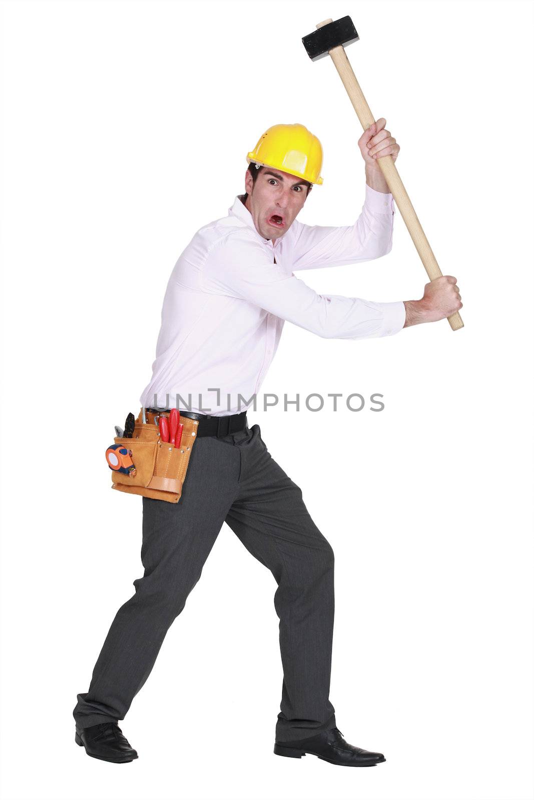 Furious man holding a mallet