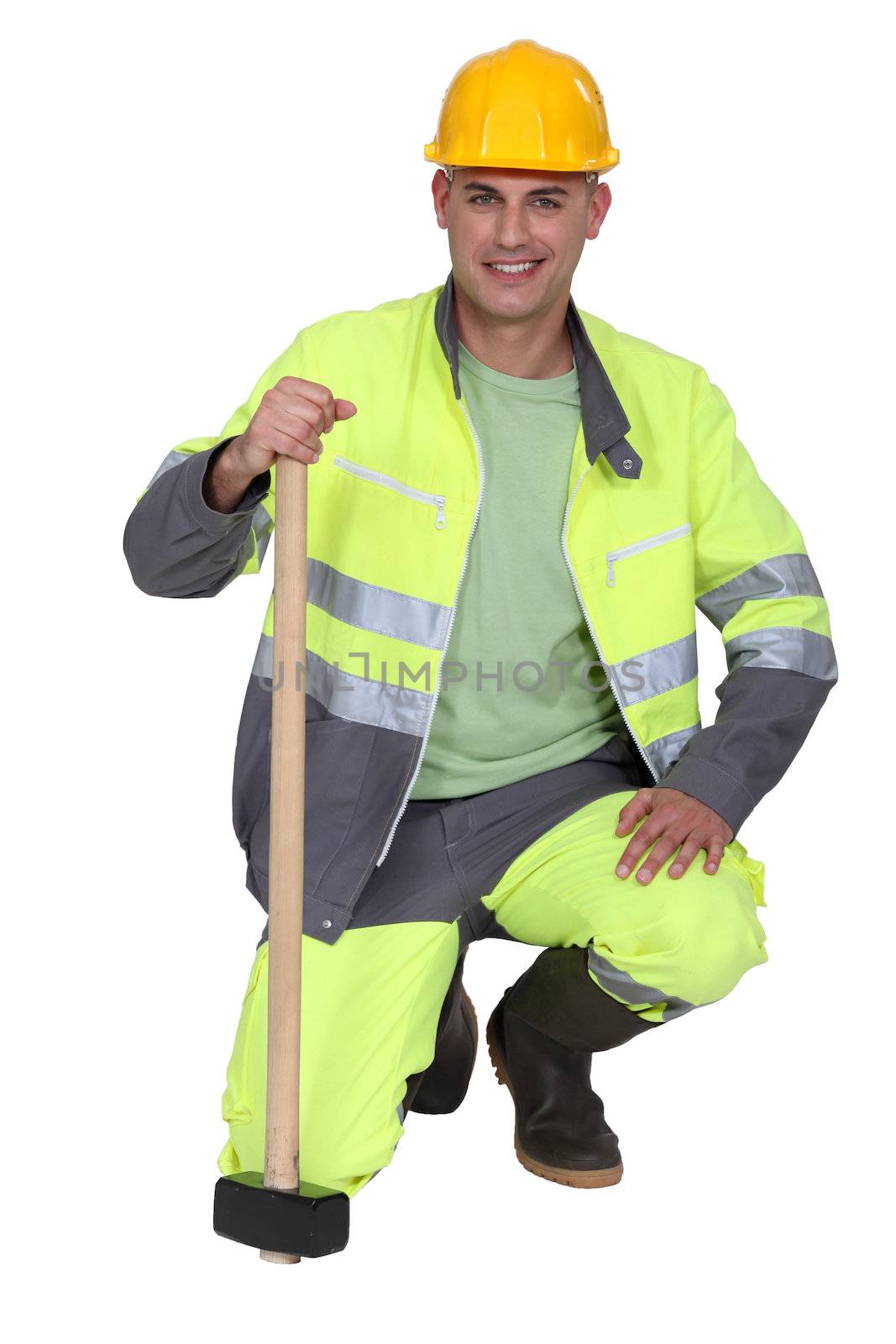 portrait of bricklayer all smiles with safety outfit