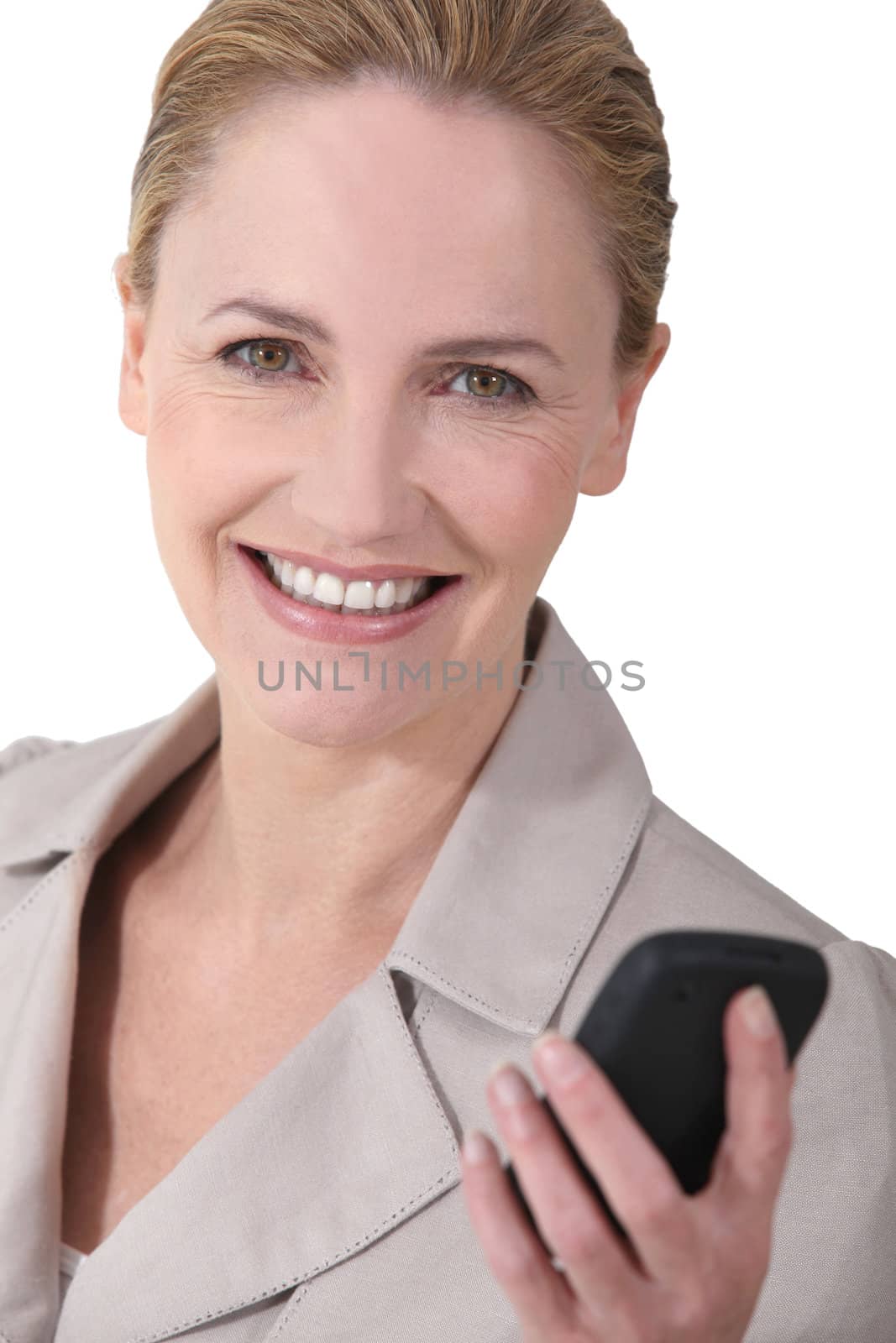 Cheerful woman sending message by phovoir