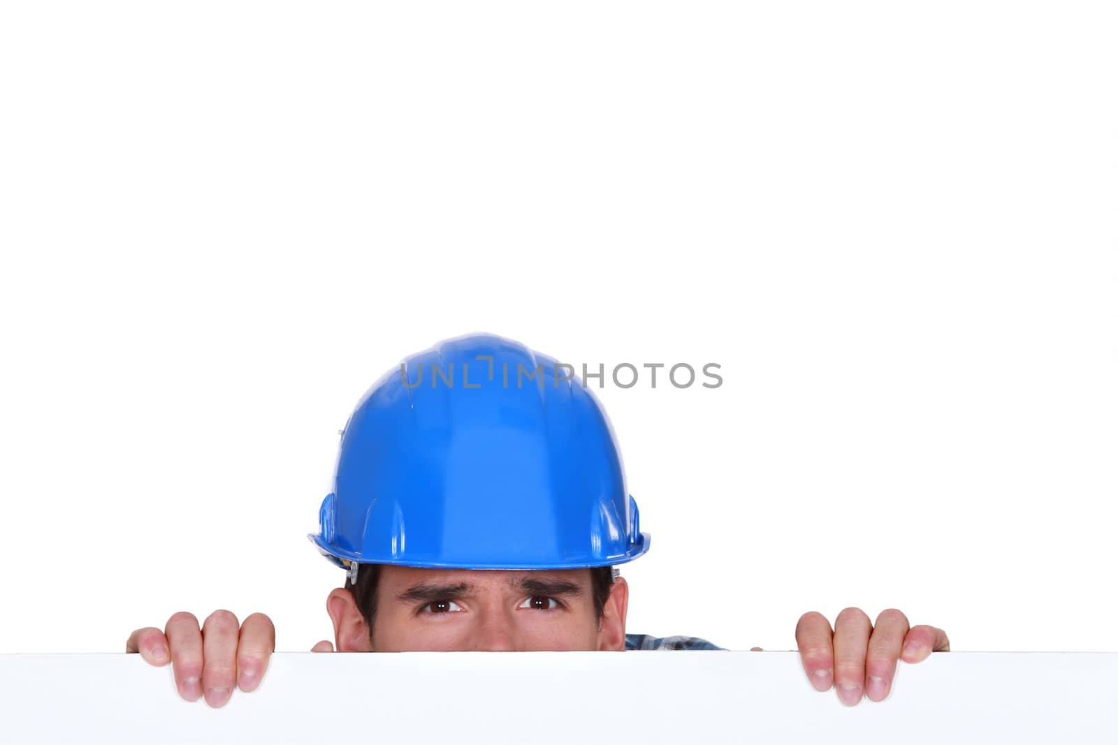 Builder peering over blank poster by phovoir