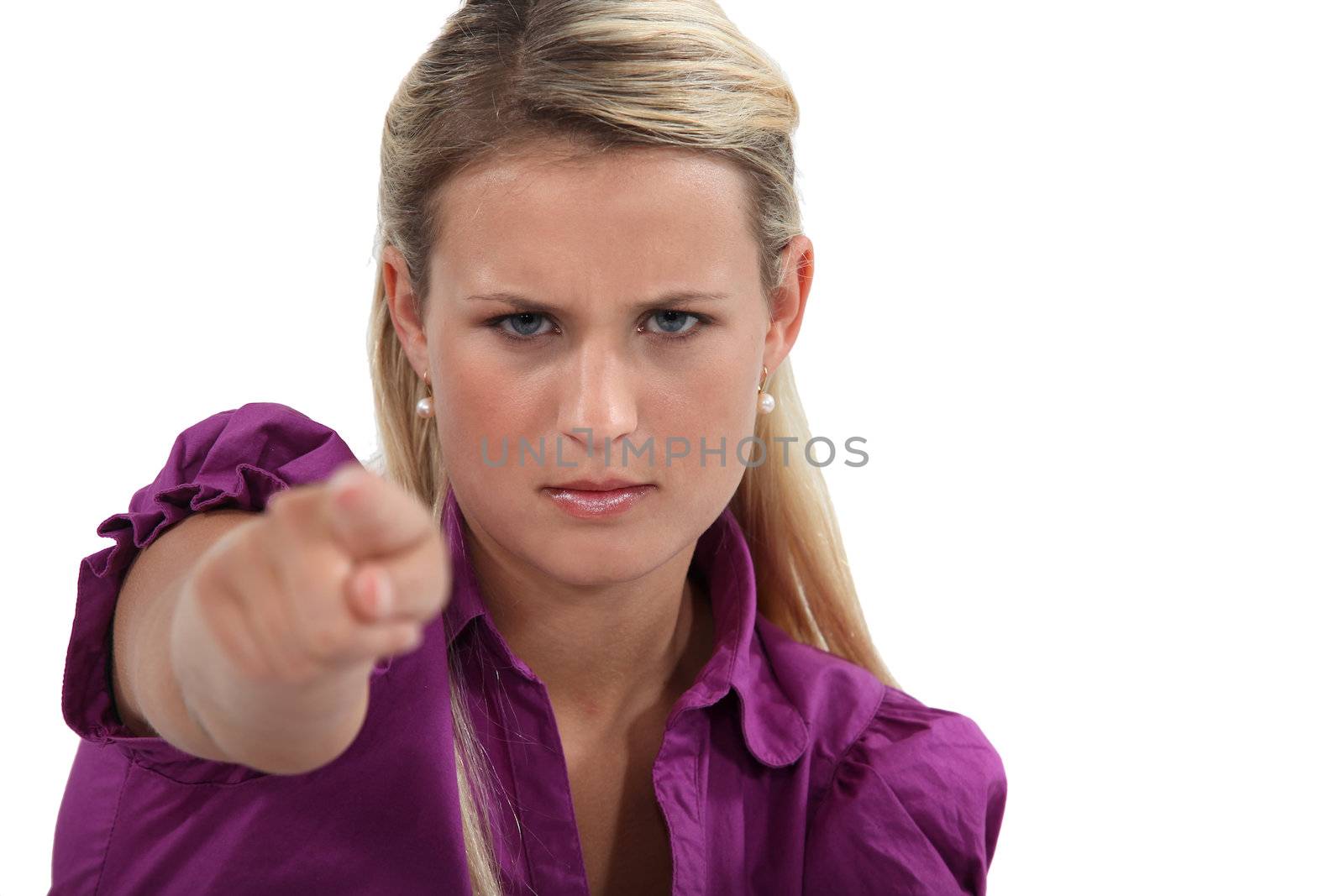 Angry woman pointing her finger by phovoir