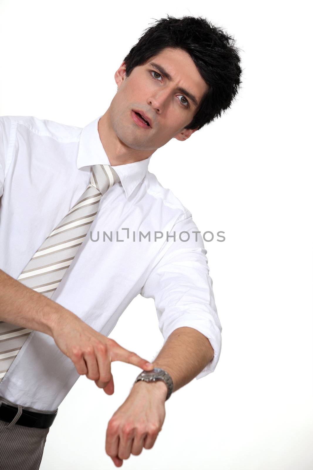businessman in a hurry pointing at his watch
