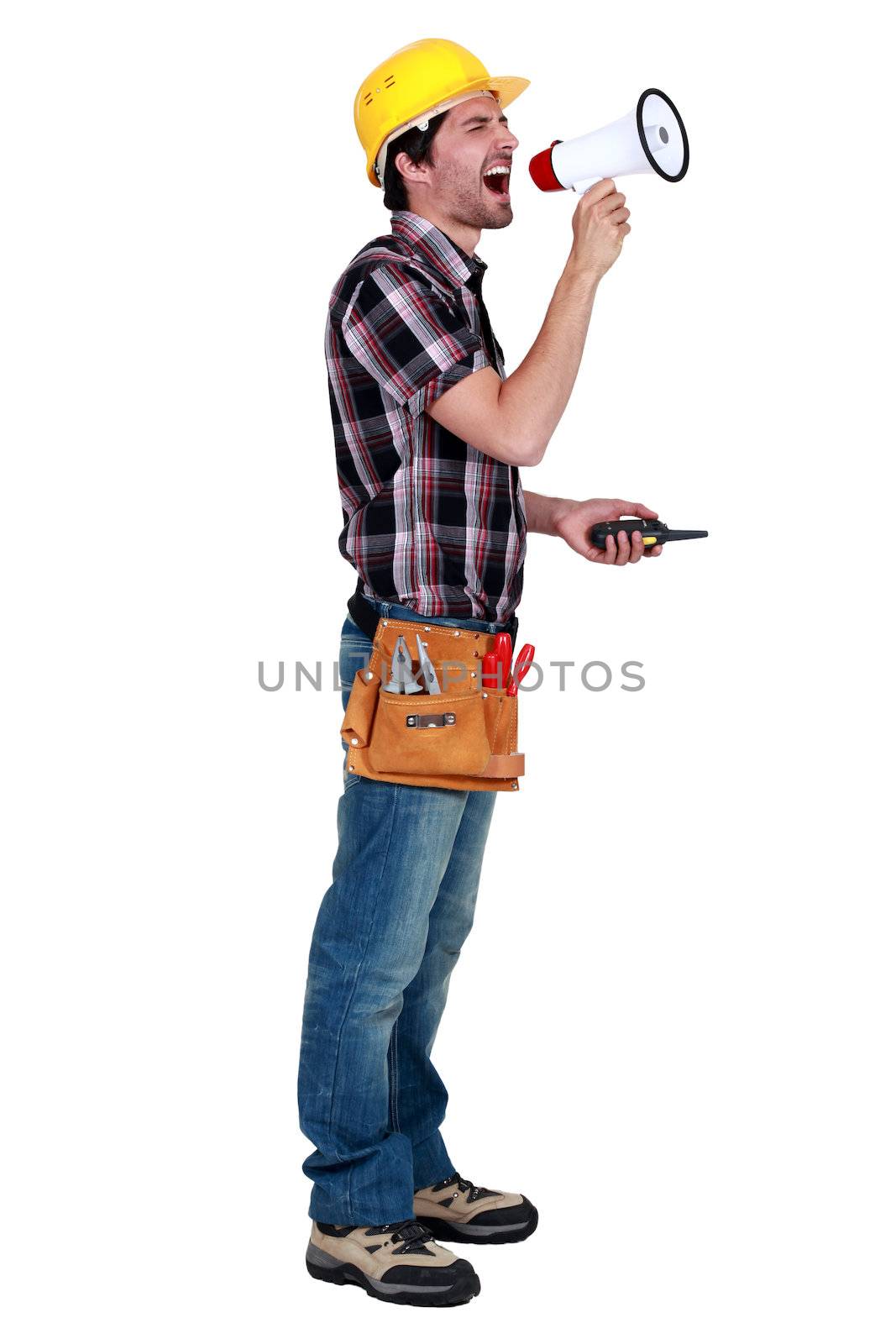 craftsman holding a walkie talkie and shouting through a megaphone by phovoir