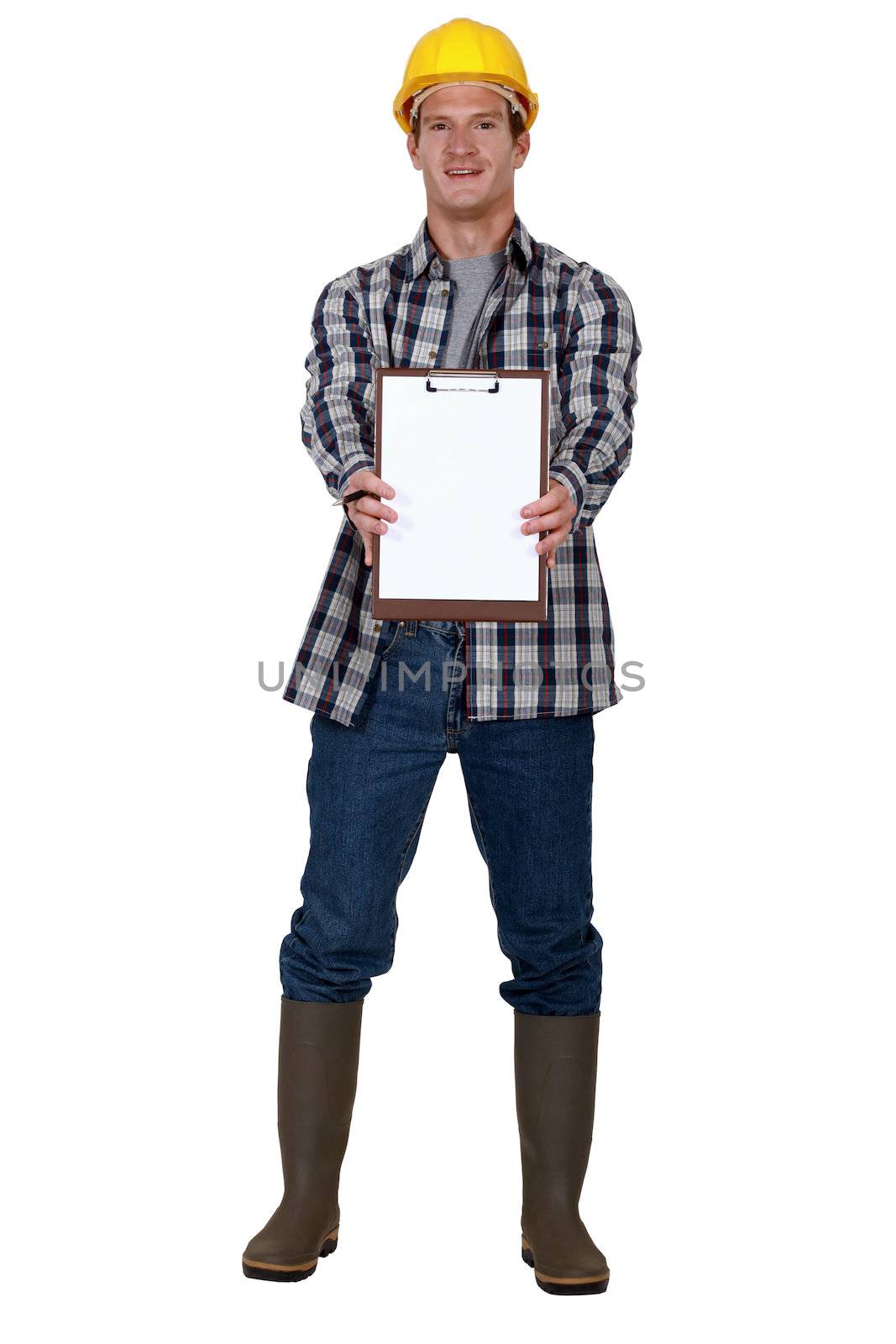 Construction worker holding clip-board by phovoir