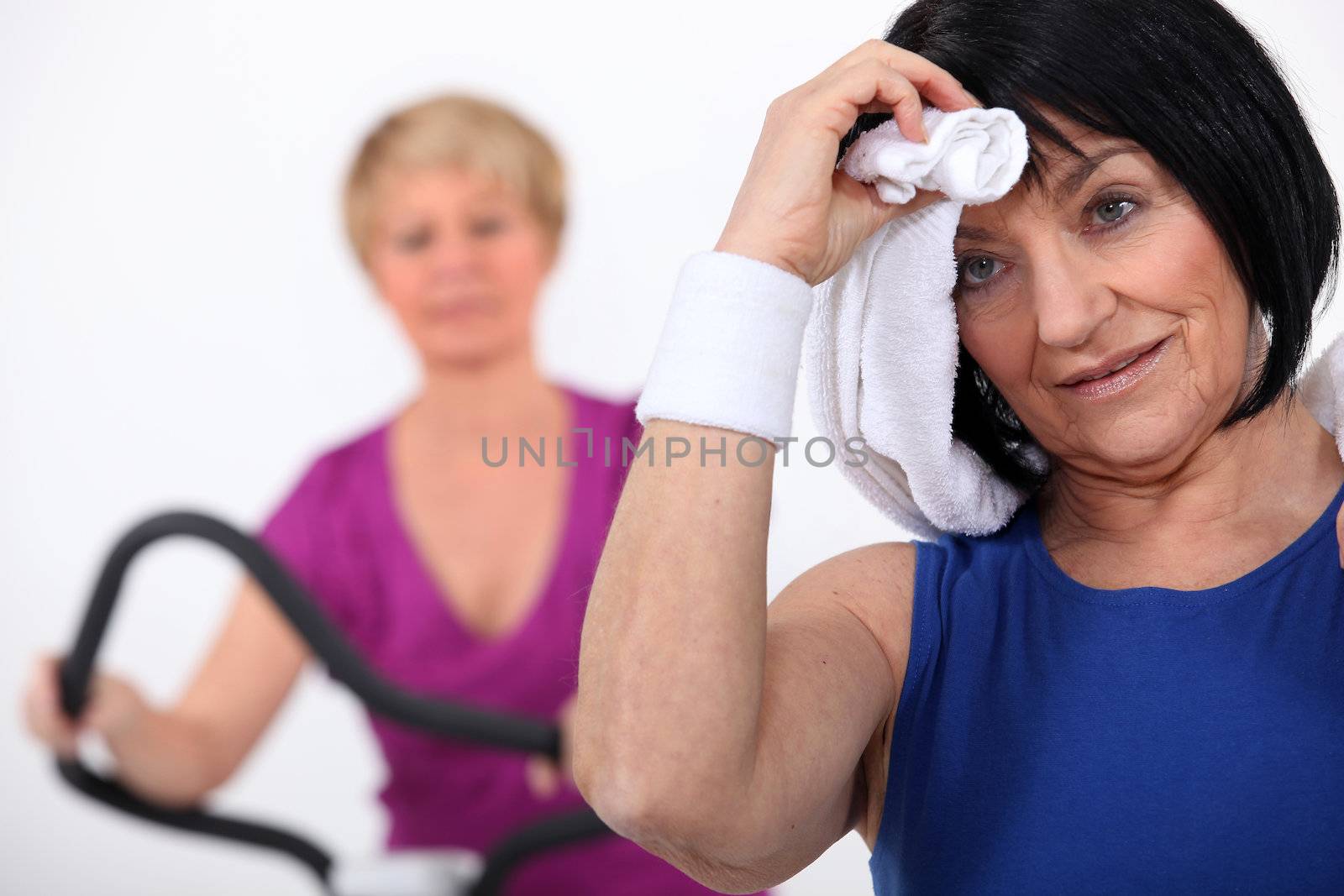Two women sweating at the gym