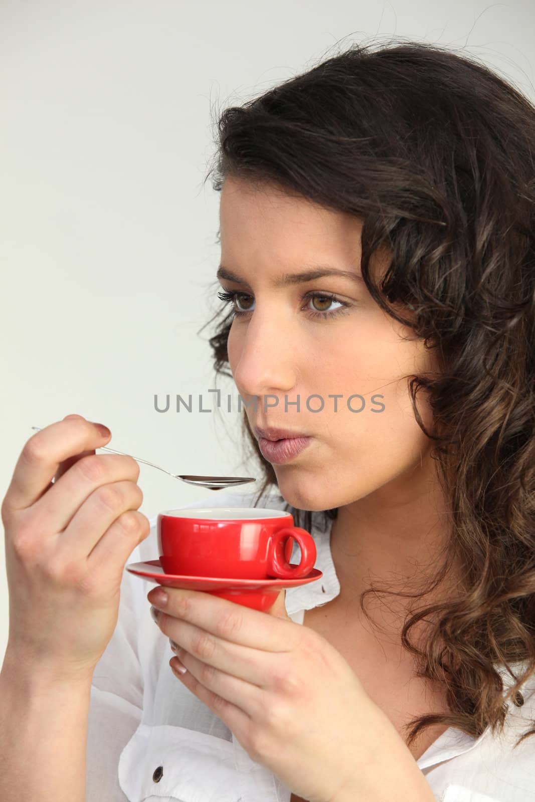 Woman having a coffee by phovoir