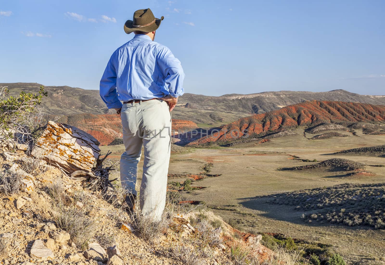 male hiker contemplates a scenery of Red Mountain Open Space in northern Colorado near Fort Collins
