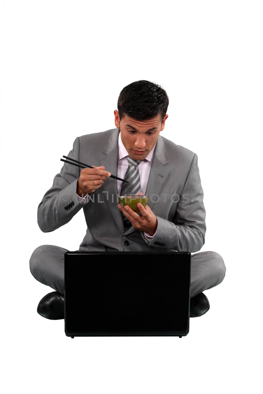 Man eating with chopsticks by phovoir