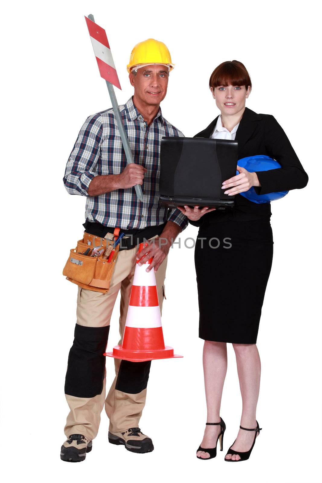 businesswoman and road worker posing together