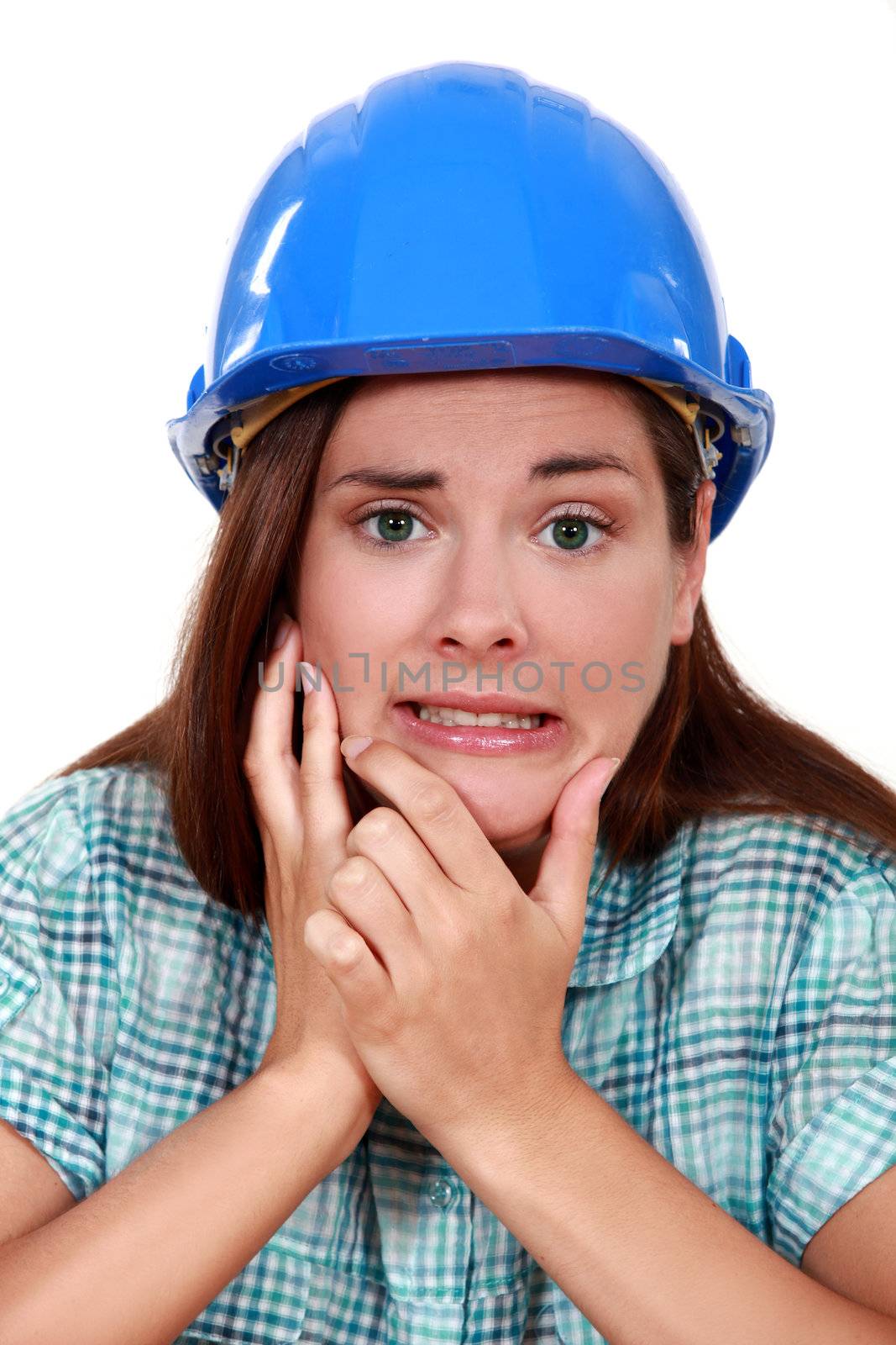 Indecisive woman in a hardhat by phovoir