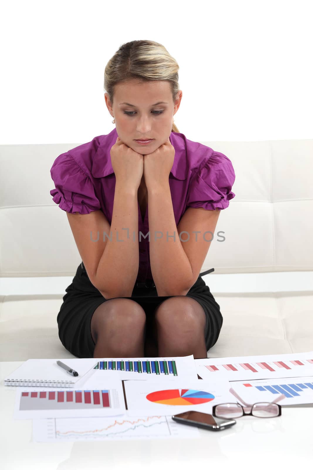 businesswoman examining graphic charts