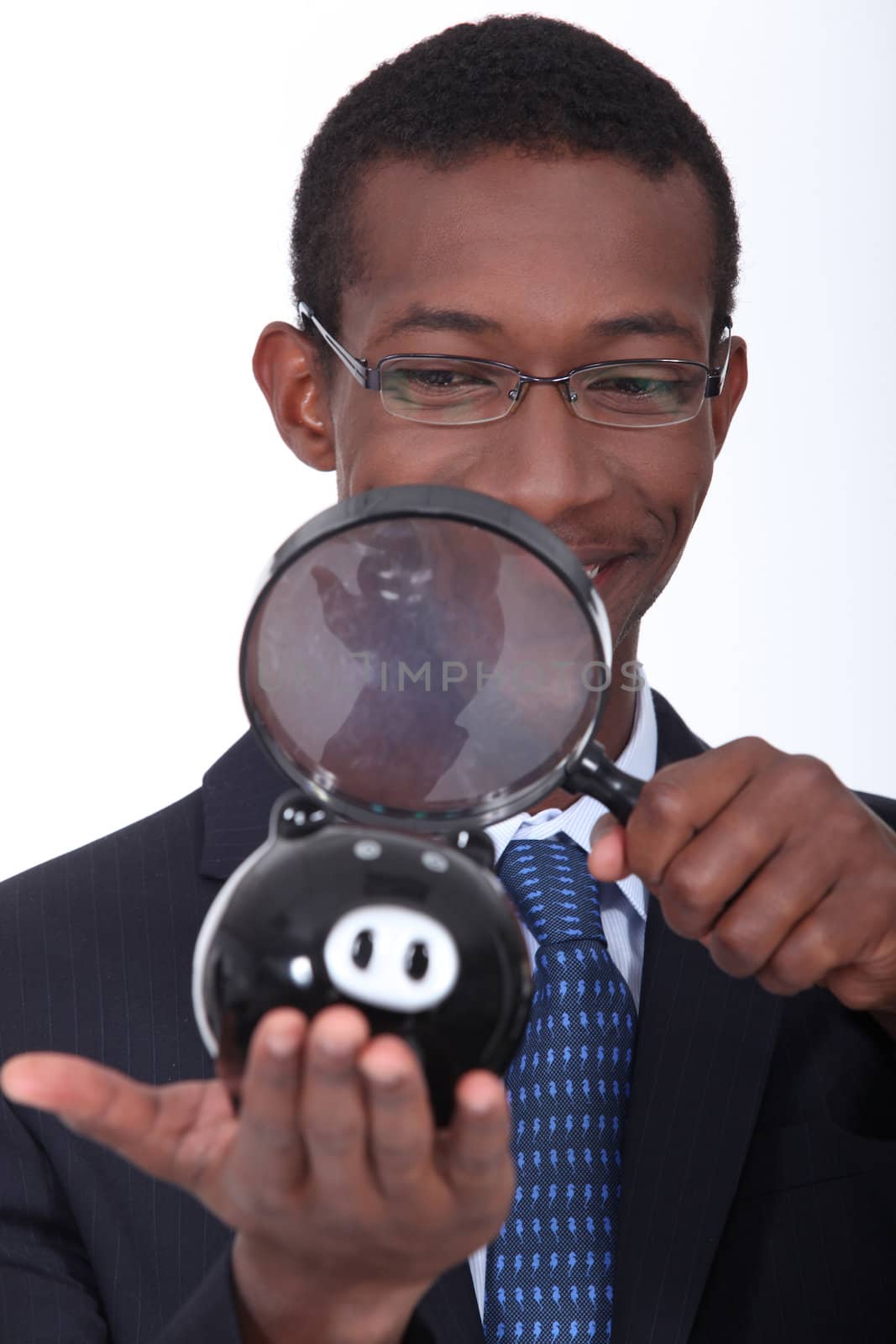 black man with a magnifying glass by phovoir