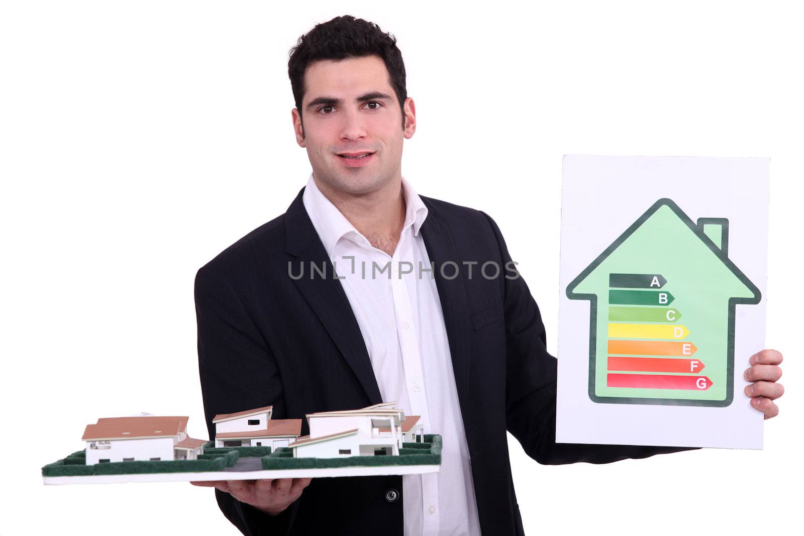 Architect holding model housing and energy rating panel