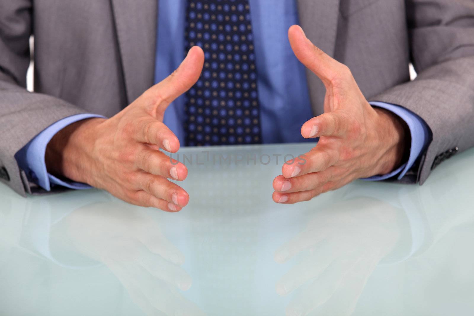 closeup on businessman's hands during speech by phovoir