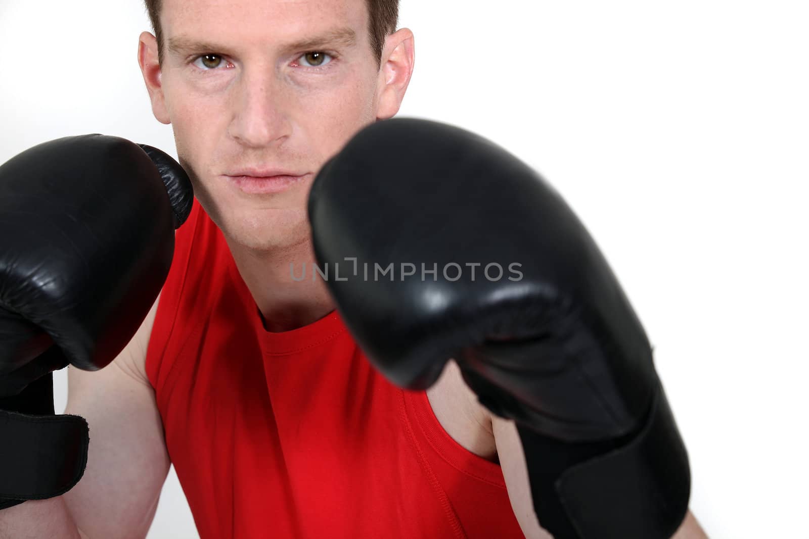 young man with boxing gloves by phovoir