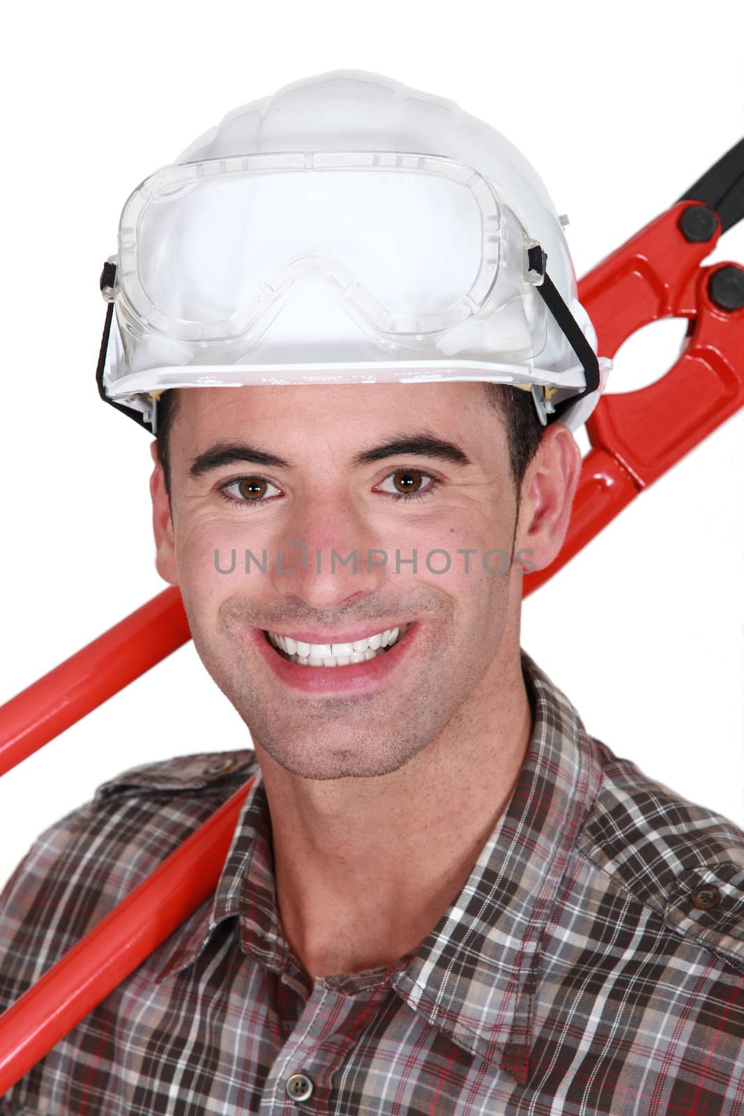 Man resting cutting tool over shoulder