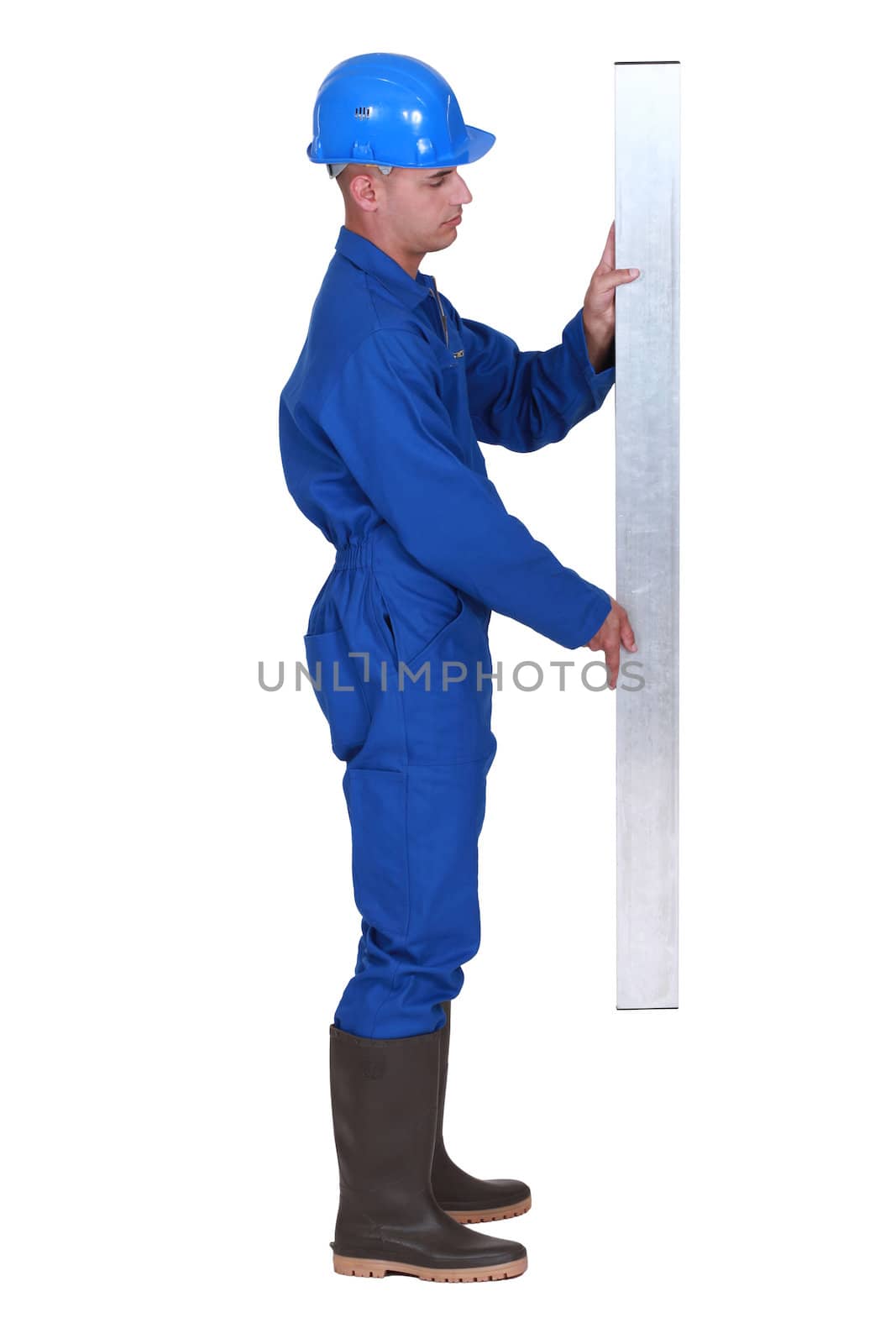craftsman holding a metal board by phovoir