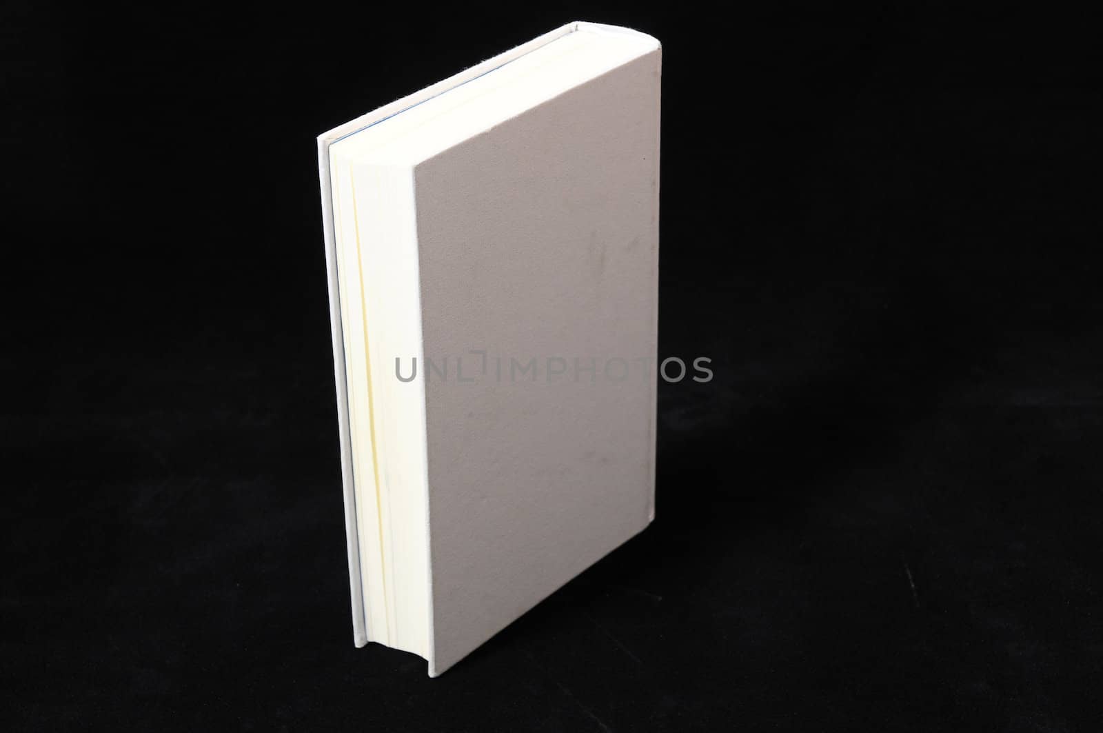 One Empty Book Isolated on a Black Background