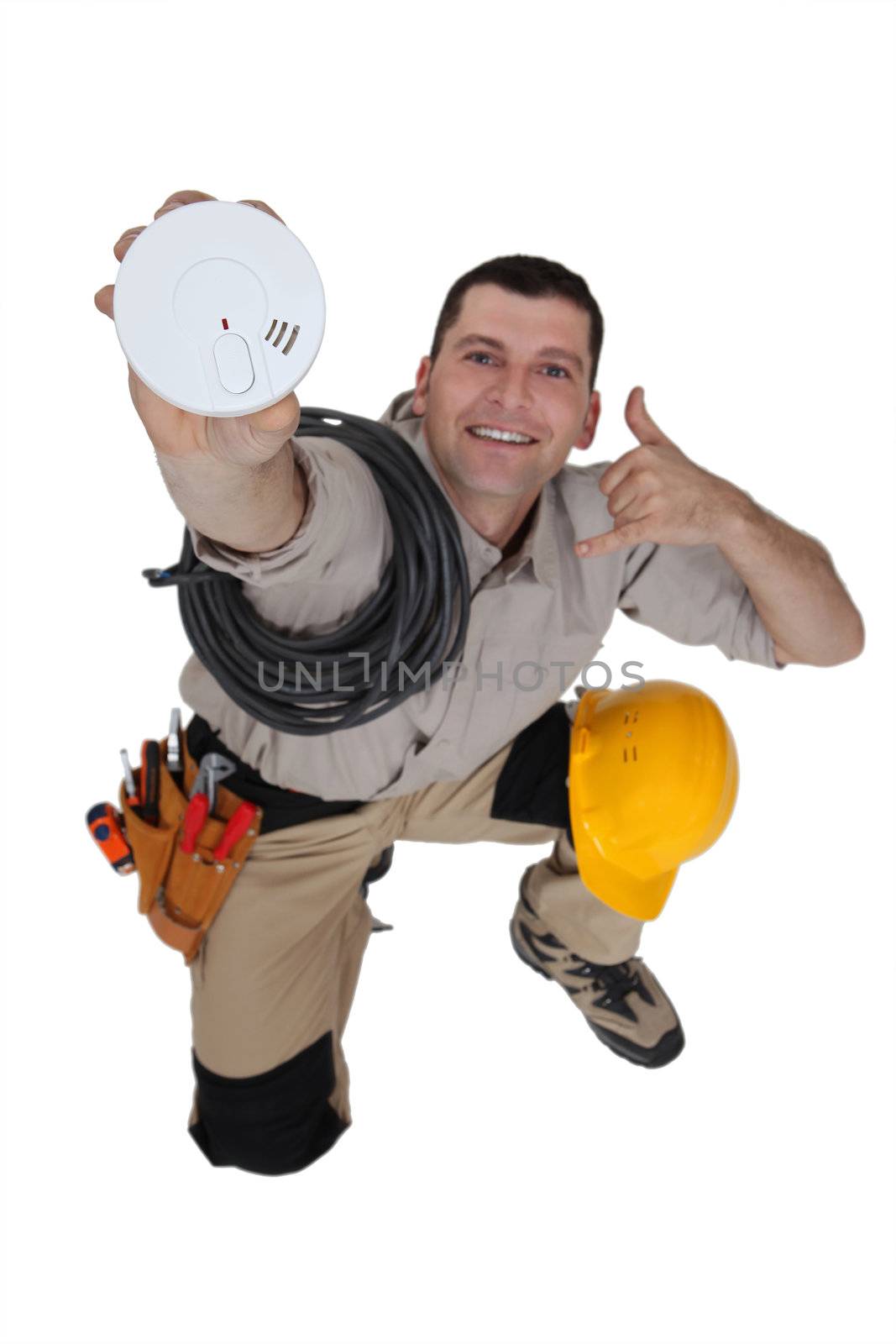 Electrician with a smoke alarm