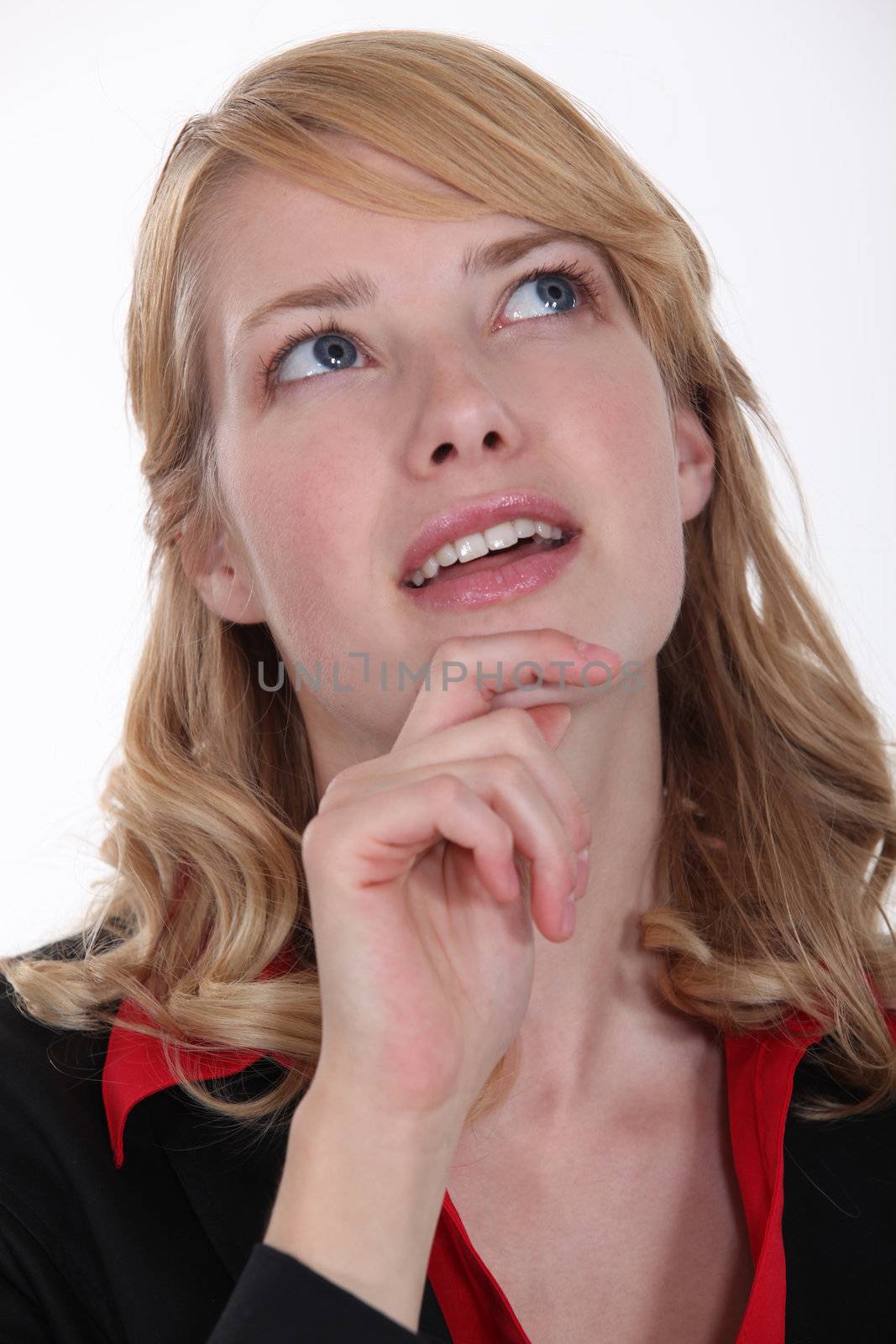 woman wondering and holding her chin
