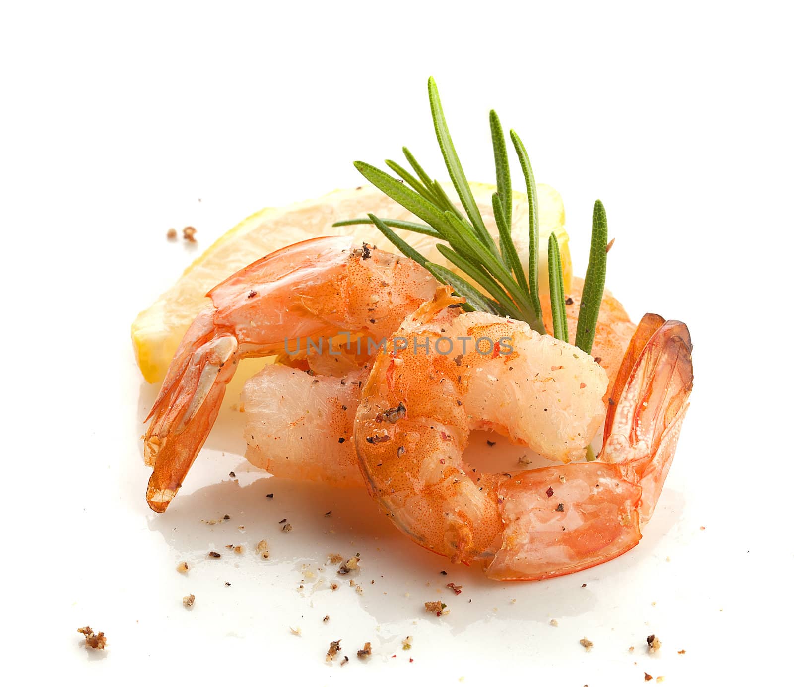 Two roasted shrimp's tails with rosemary and lemon
