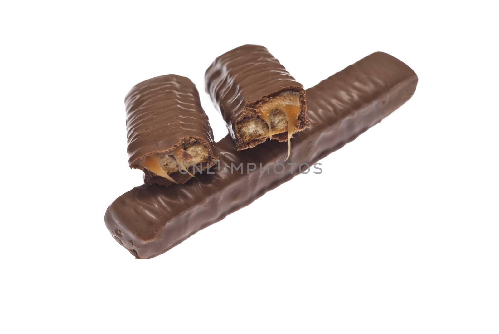 Chocolate caramel bar isolated on white background