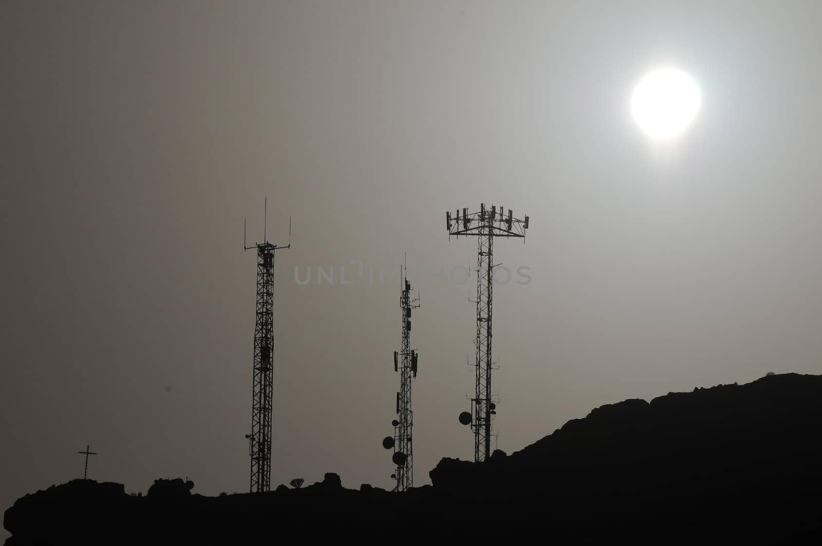 Some Silhouetted Antennas on the top of a Hill