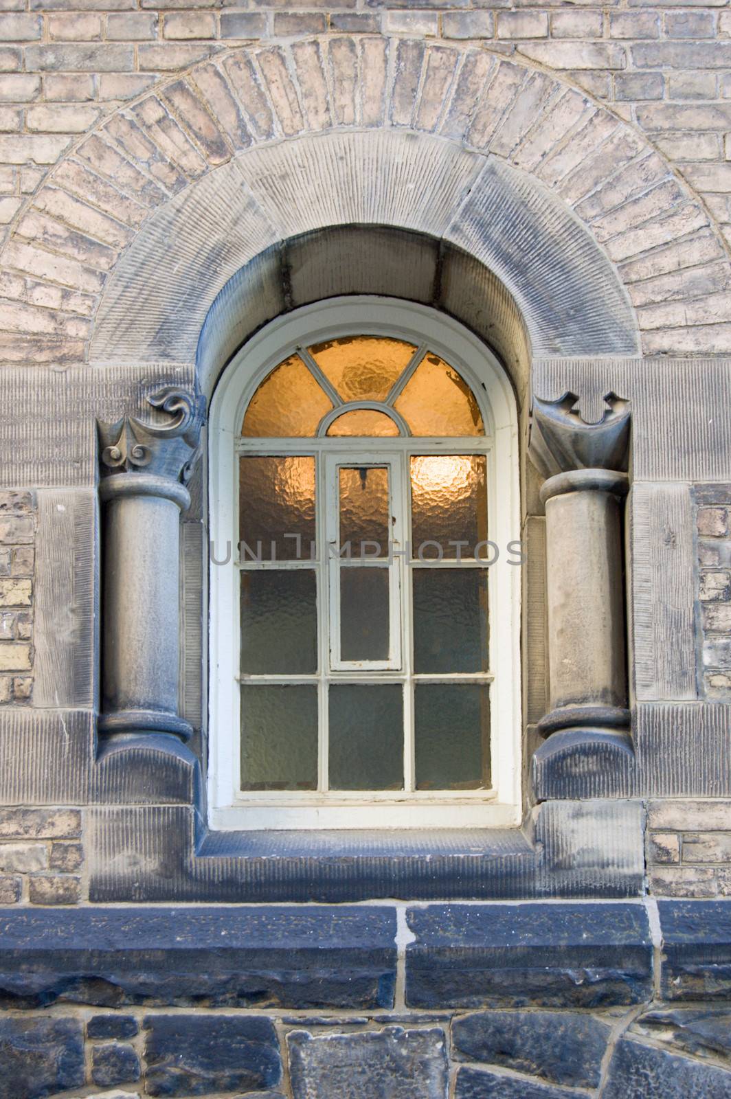Light behind blure glass of window of old building