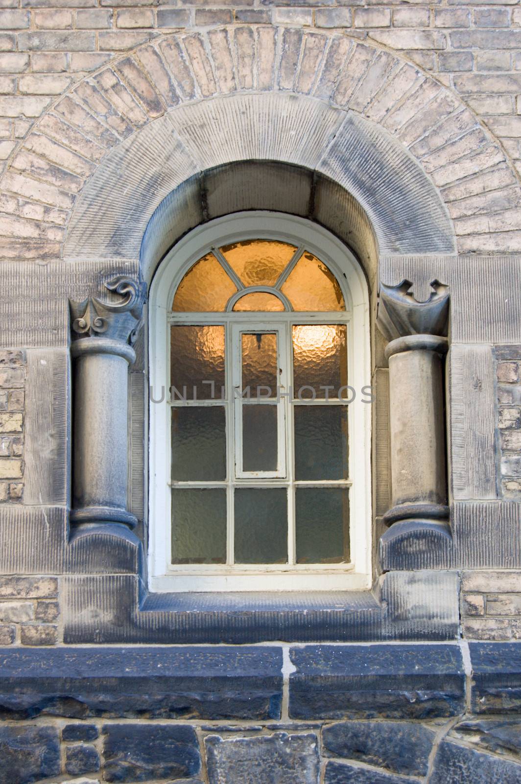 Light behind blure glass of window of old building