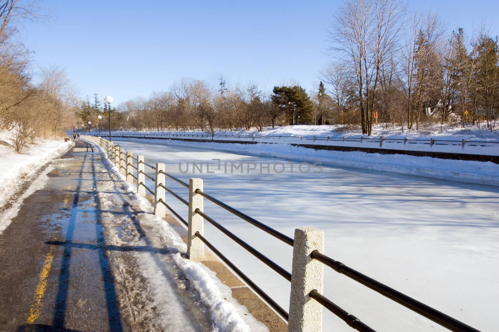 Sidewalk along Rideau Canal in winter day