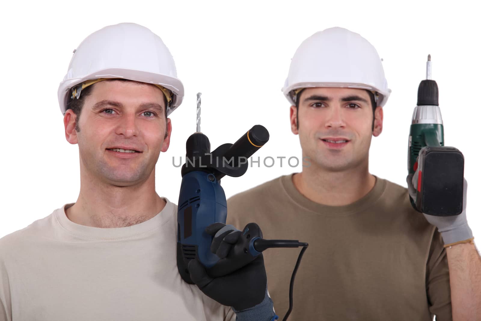Man with drill in hand by phovoir