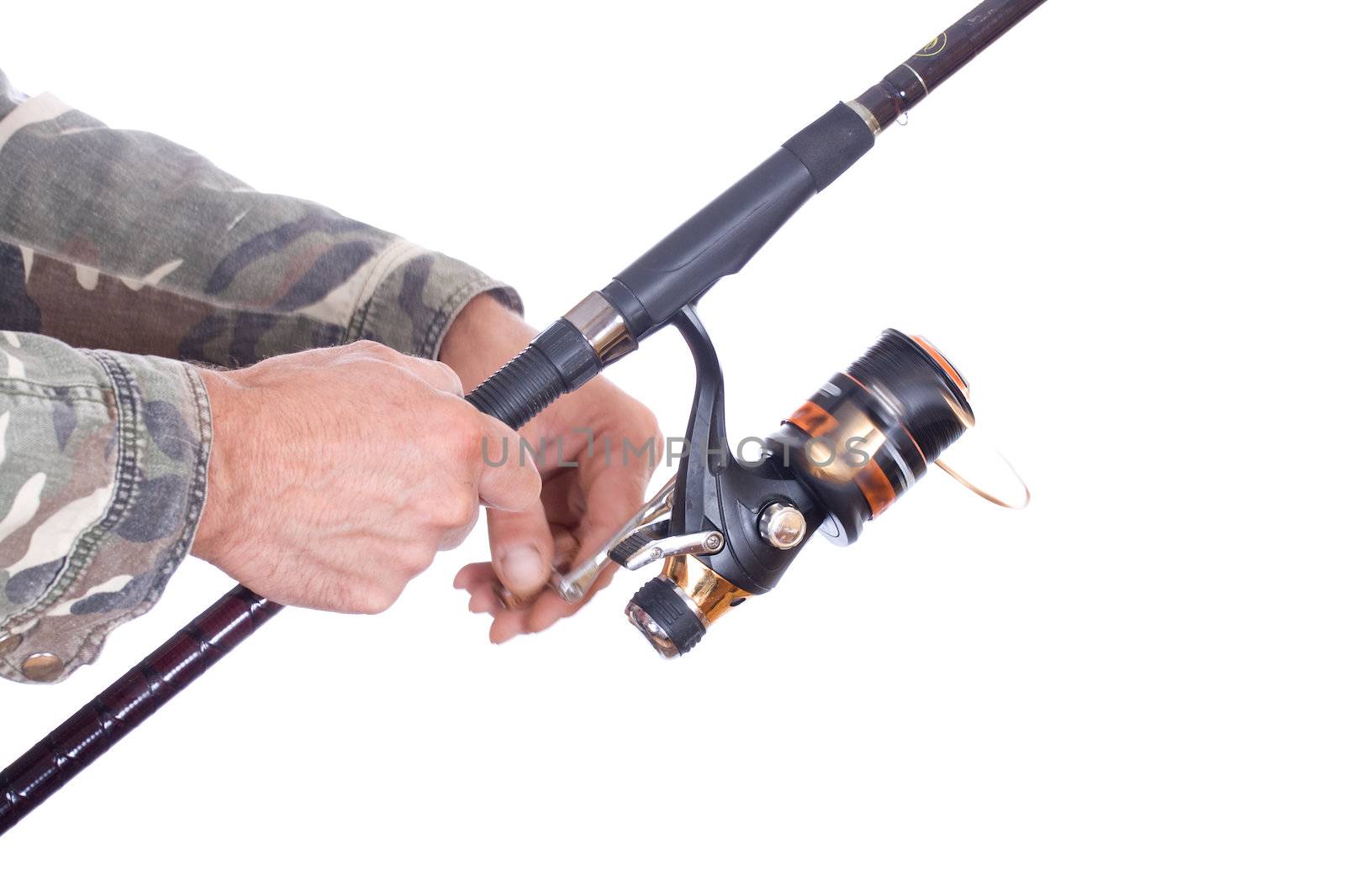 Closeup of a man hand holding a fishing rod and reel