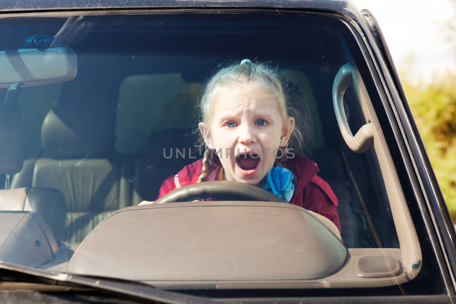 Crying scared girl in the car by vsurkov