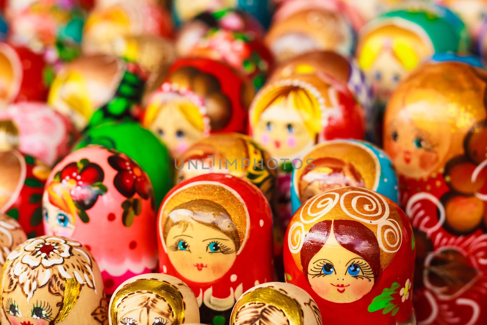 Colorful Russian nesting dolls at the market by ryhor