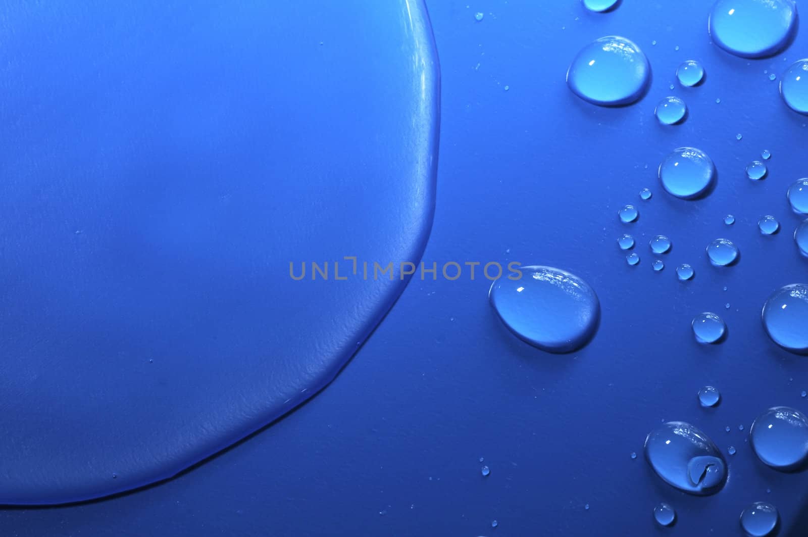 Some Water Drops on a Blue Textured Background