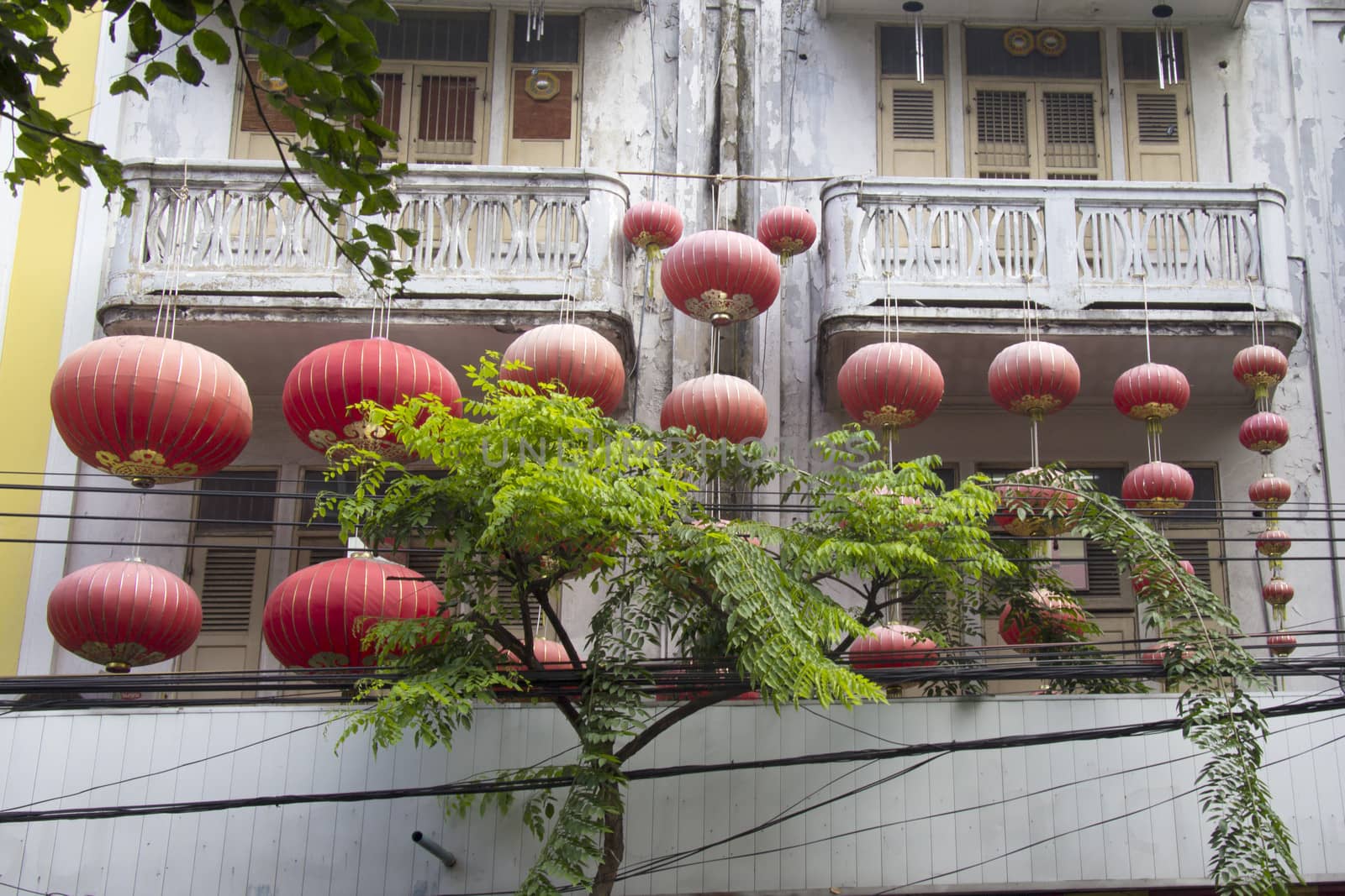 Chinese lanterns hanging from a balcony in Chinatown, Bangkok