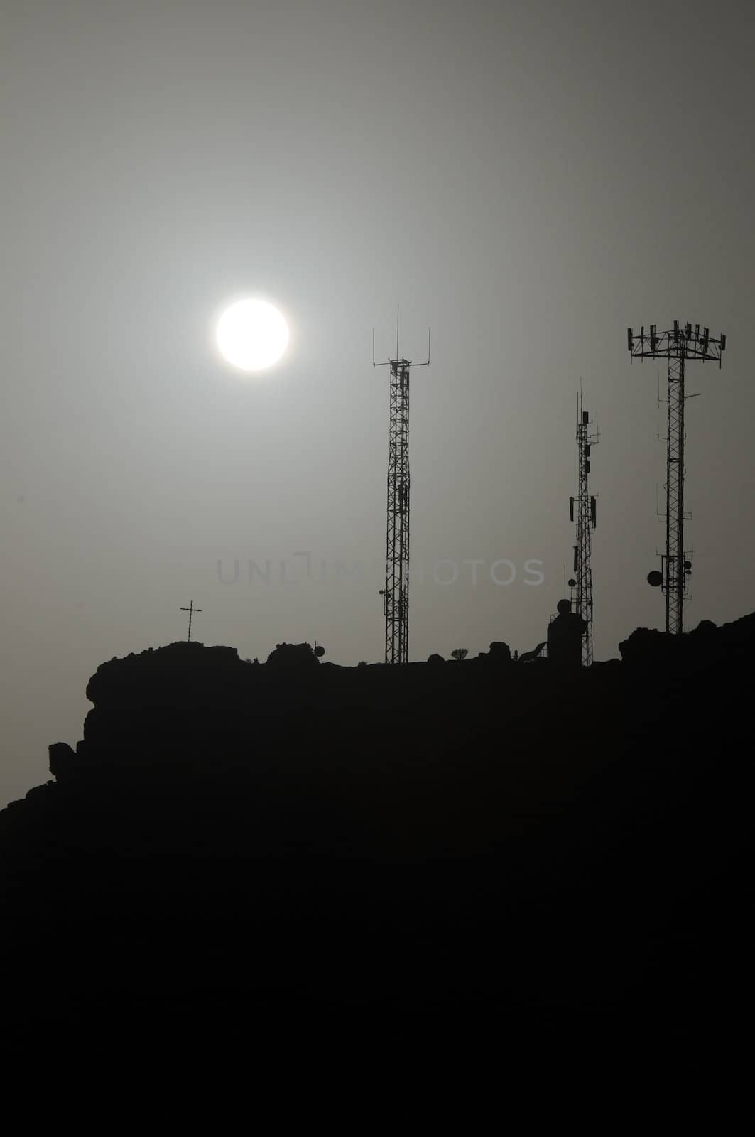 Some Silhouetted Antennas on the top of a Hill