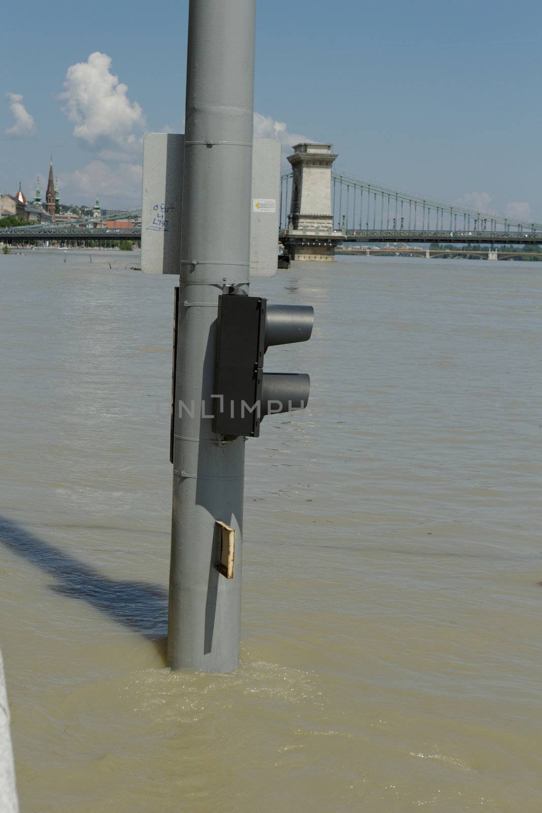 traffic light on flooding river