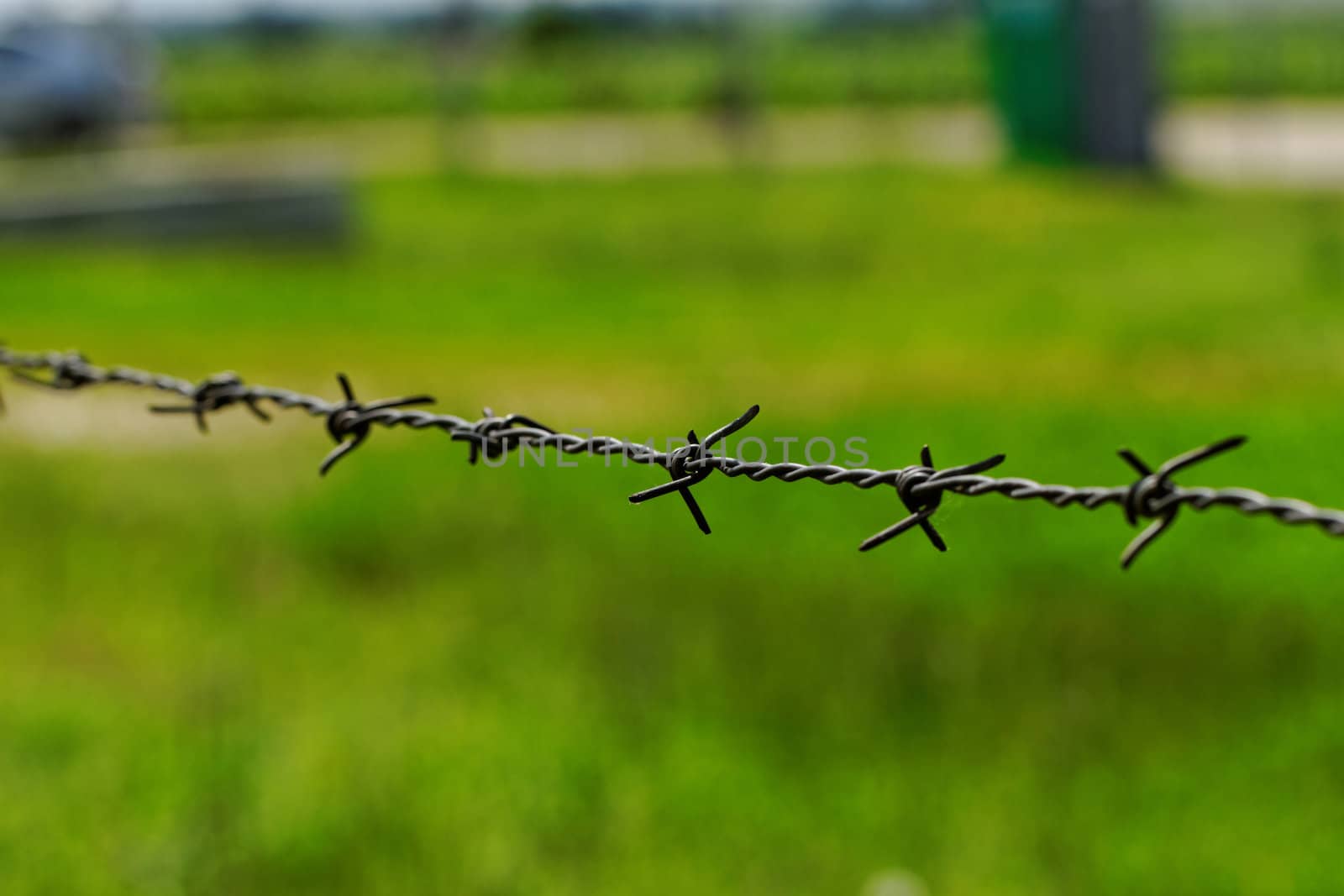 barbed wire defending the industries