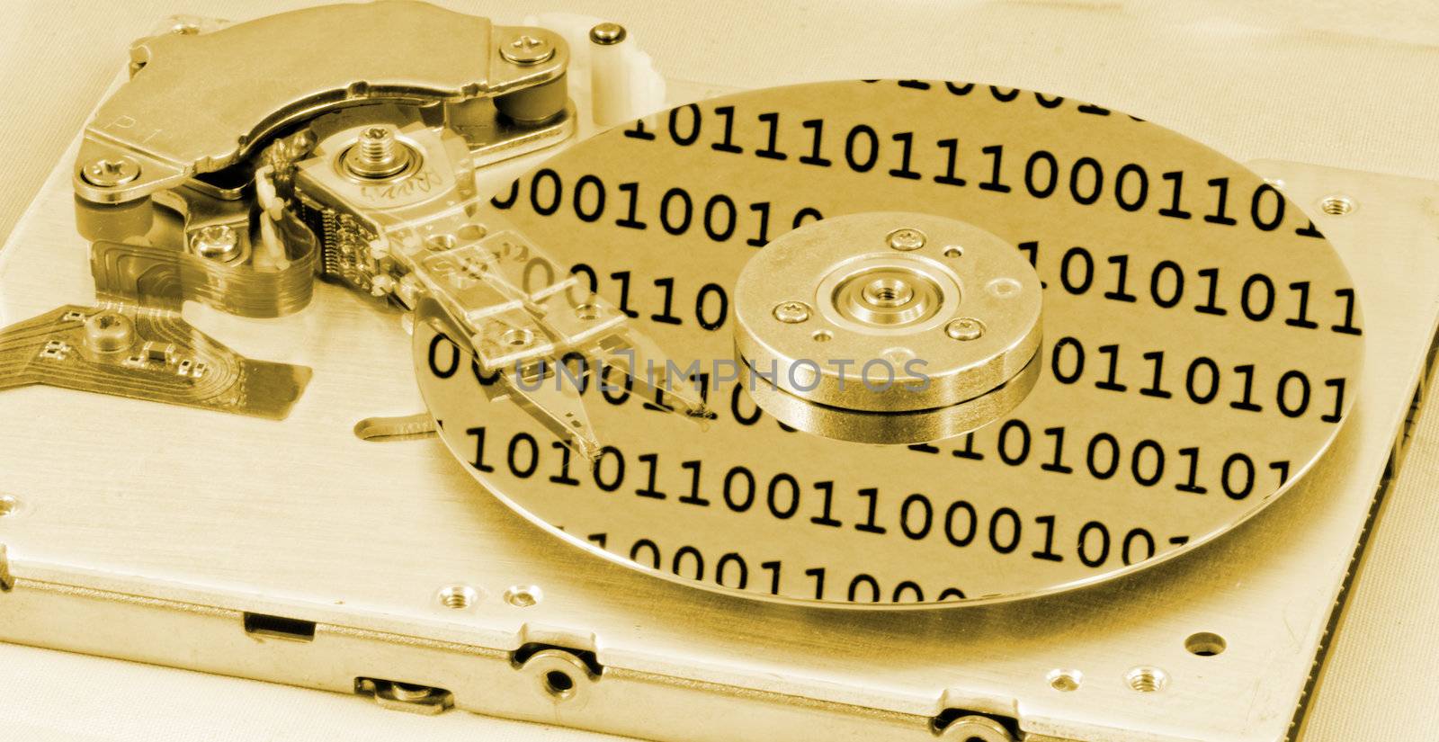 Internals of a computer harddrive with binary number reflections with yellow colors (HDD, winchester)