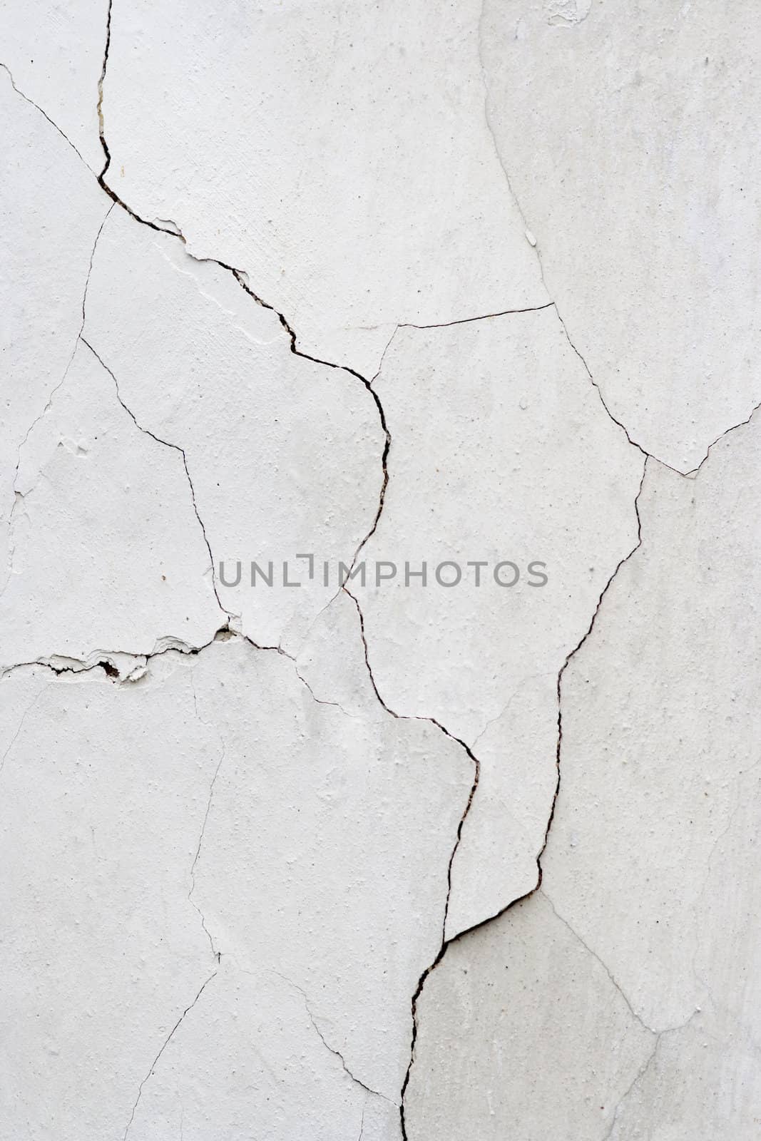 Detail of the cracked stucco - abstract grunge background