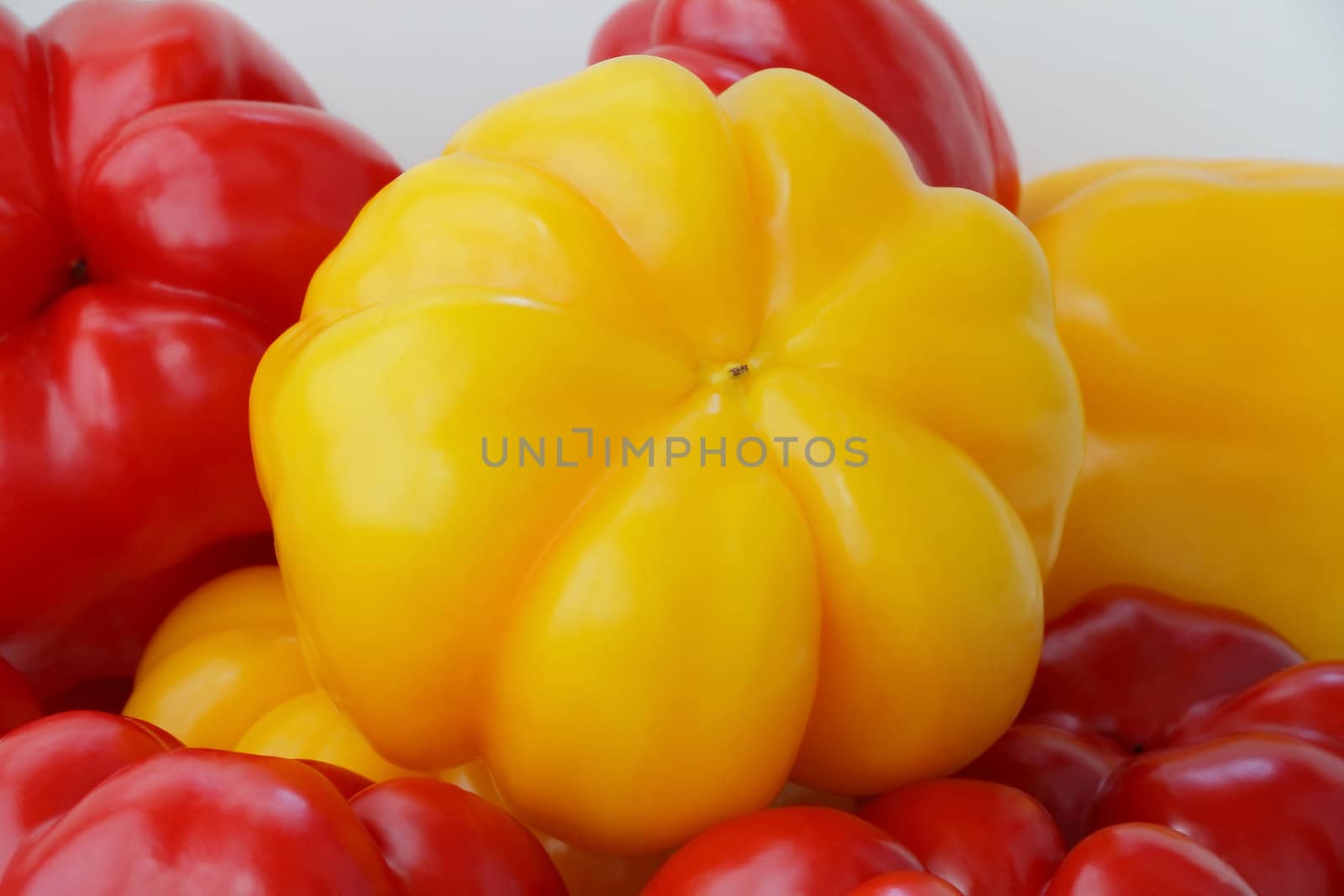 Image of red and yellow raw pepper