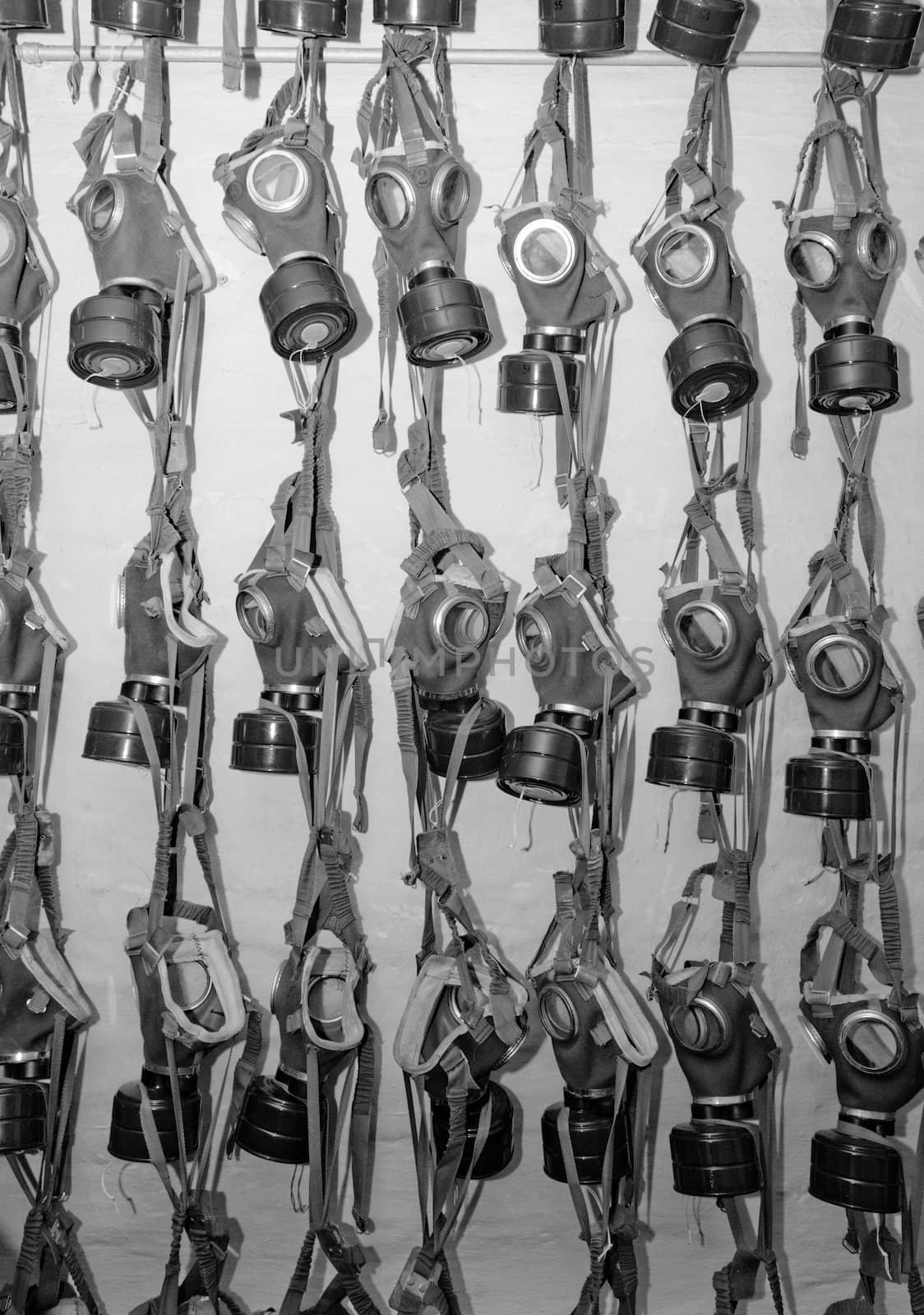 old military gas masks hanging on each other