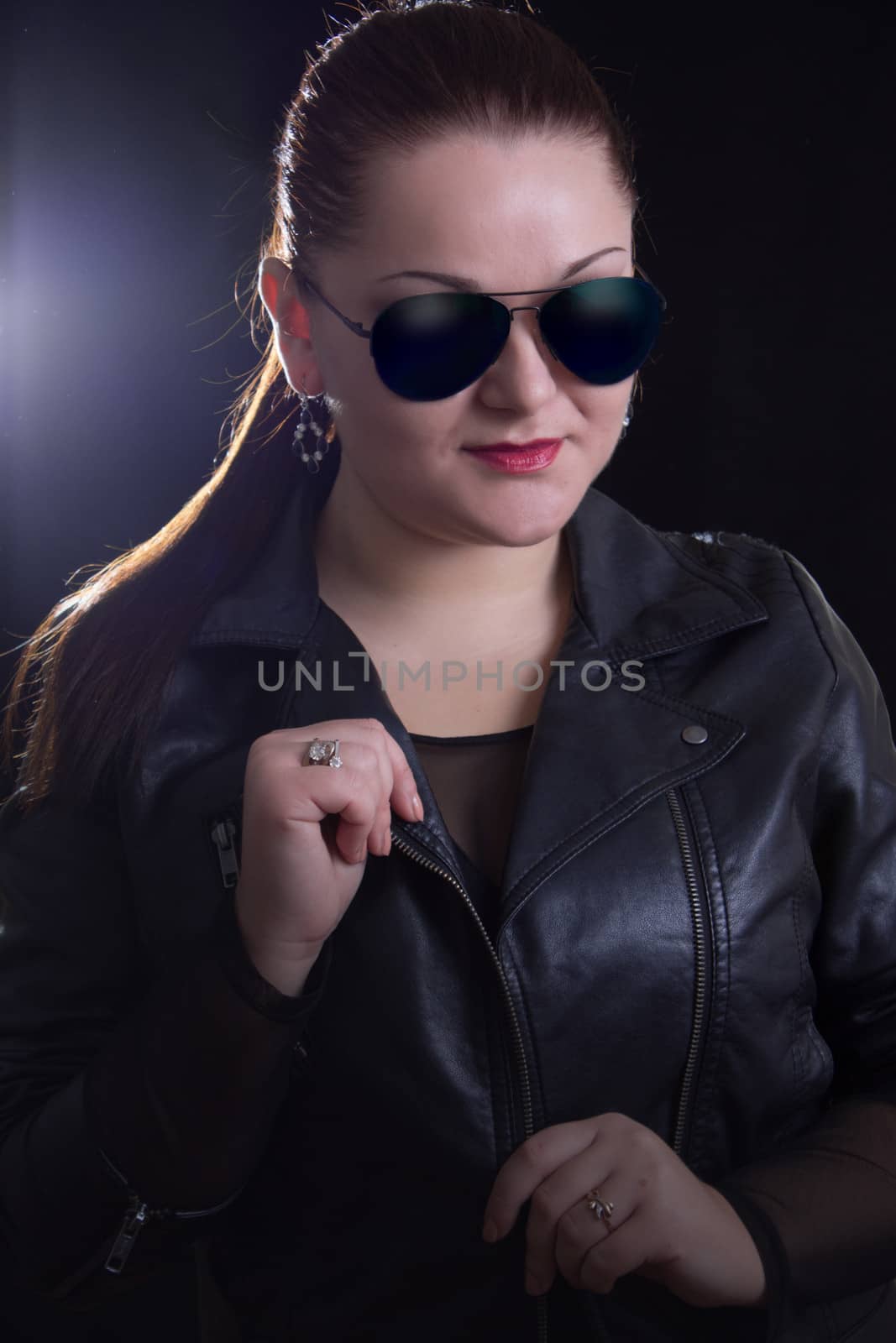 Rock woman with leather jacket and glasses
