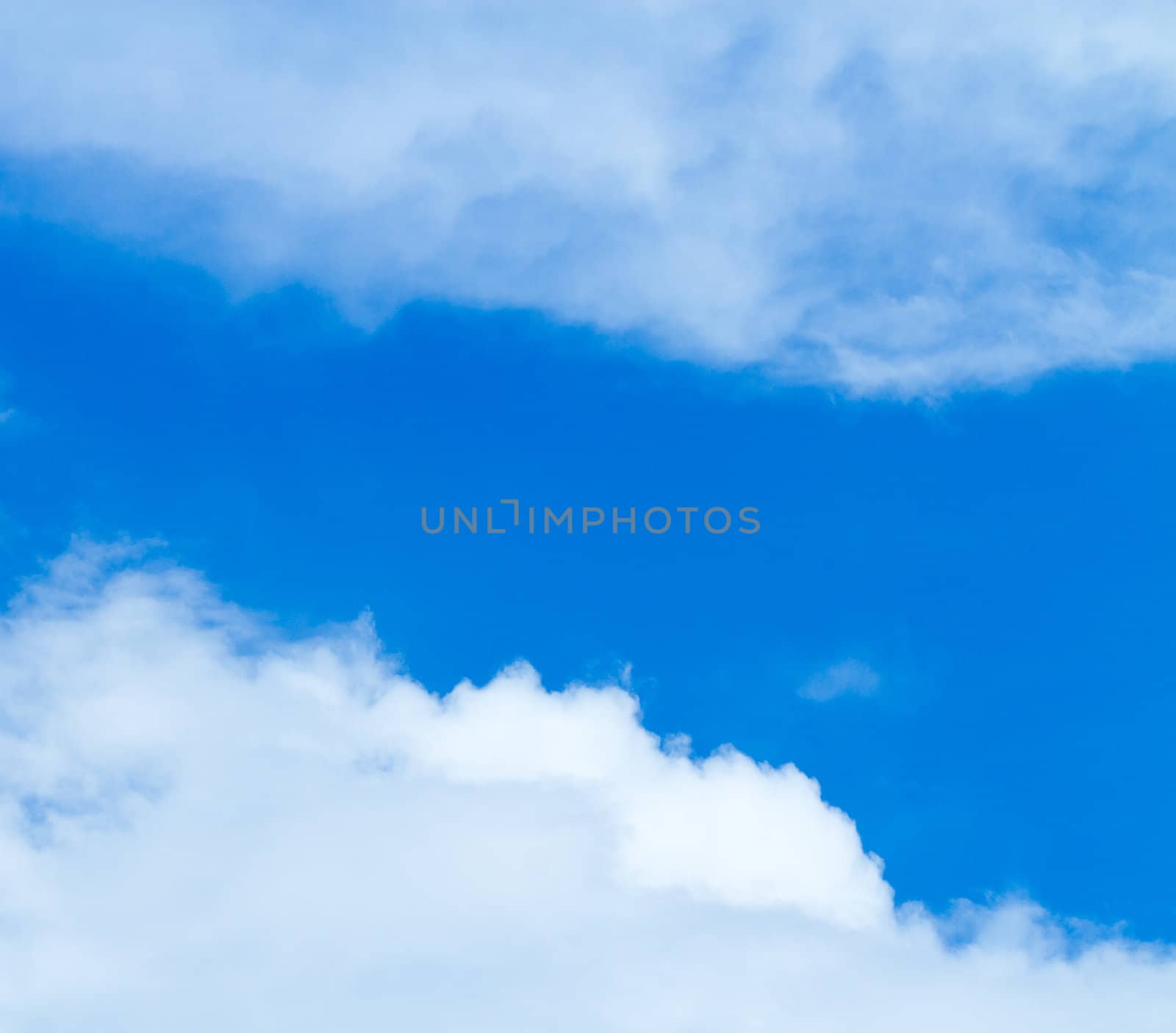 Blue sky with two half cloud