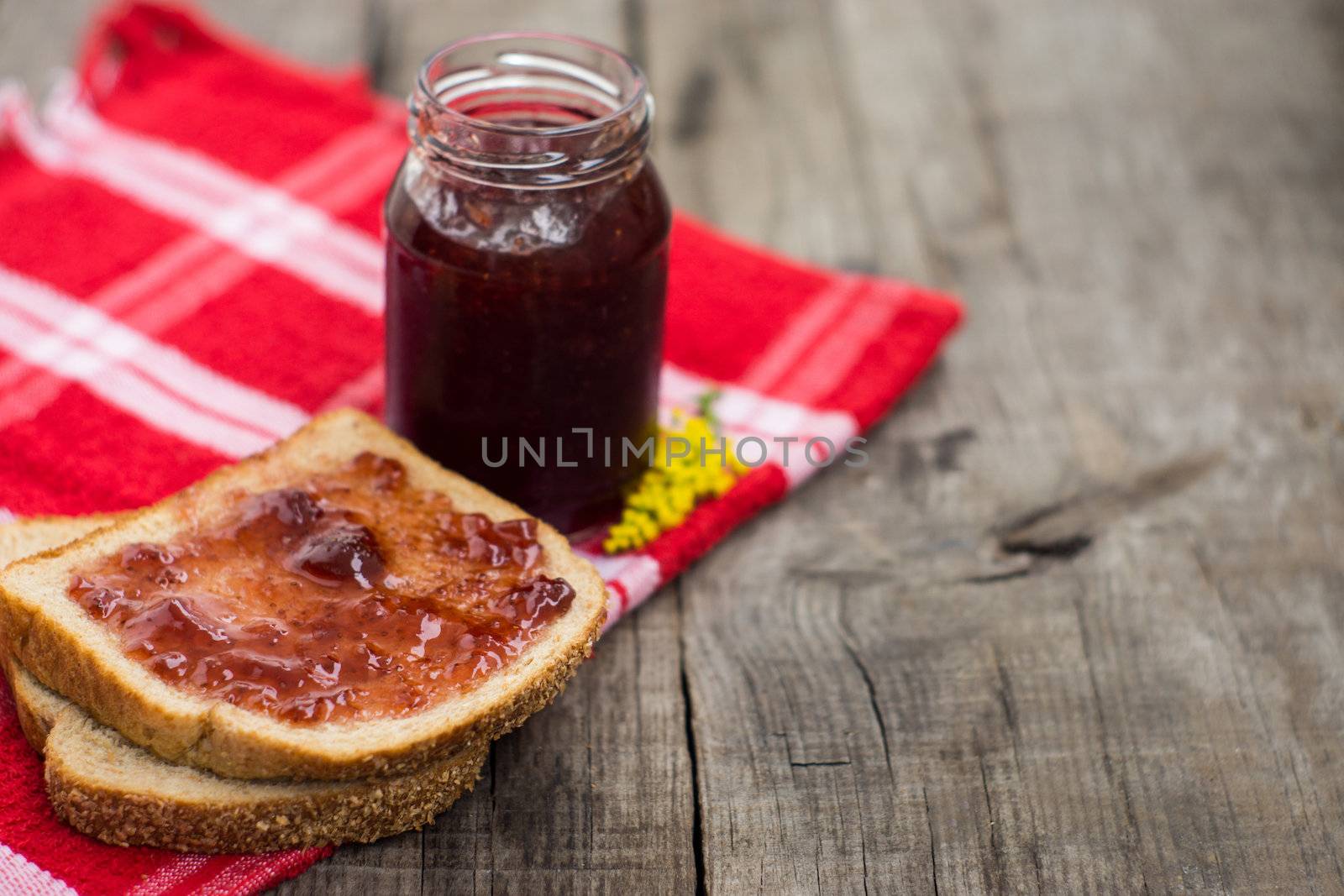 A Marmalade Sandwich on wood textured background