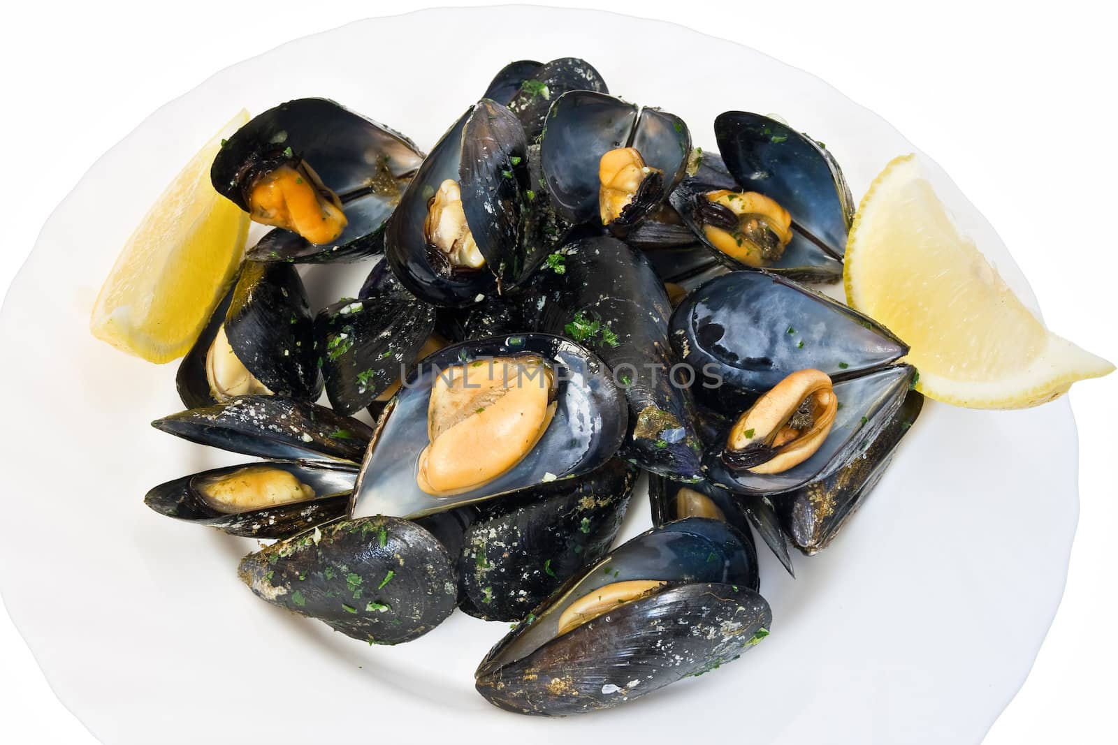 typical mediterranean dish: boiled mussels with parsley and lemon