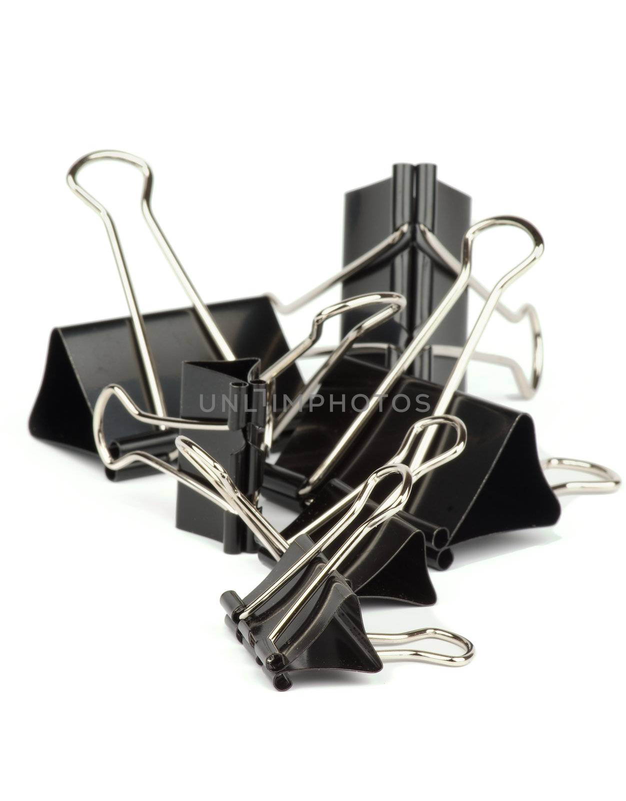 Heap of Black Metal Paper Clip isolated on white background