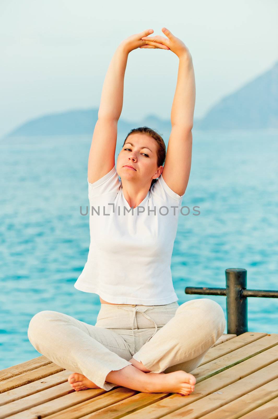 beautiful woman has a banner on a wooden pier